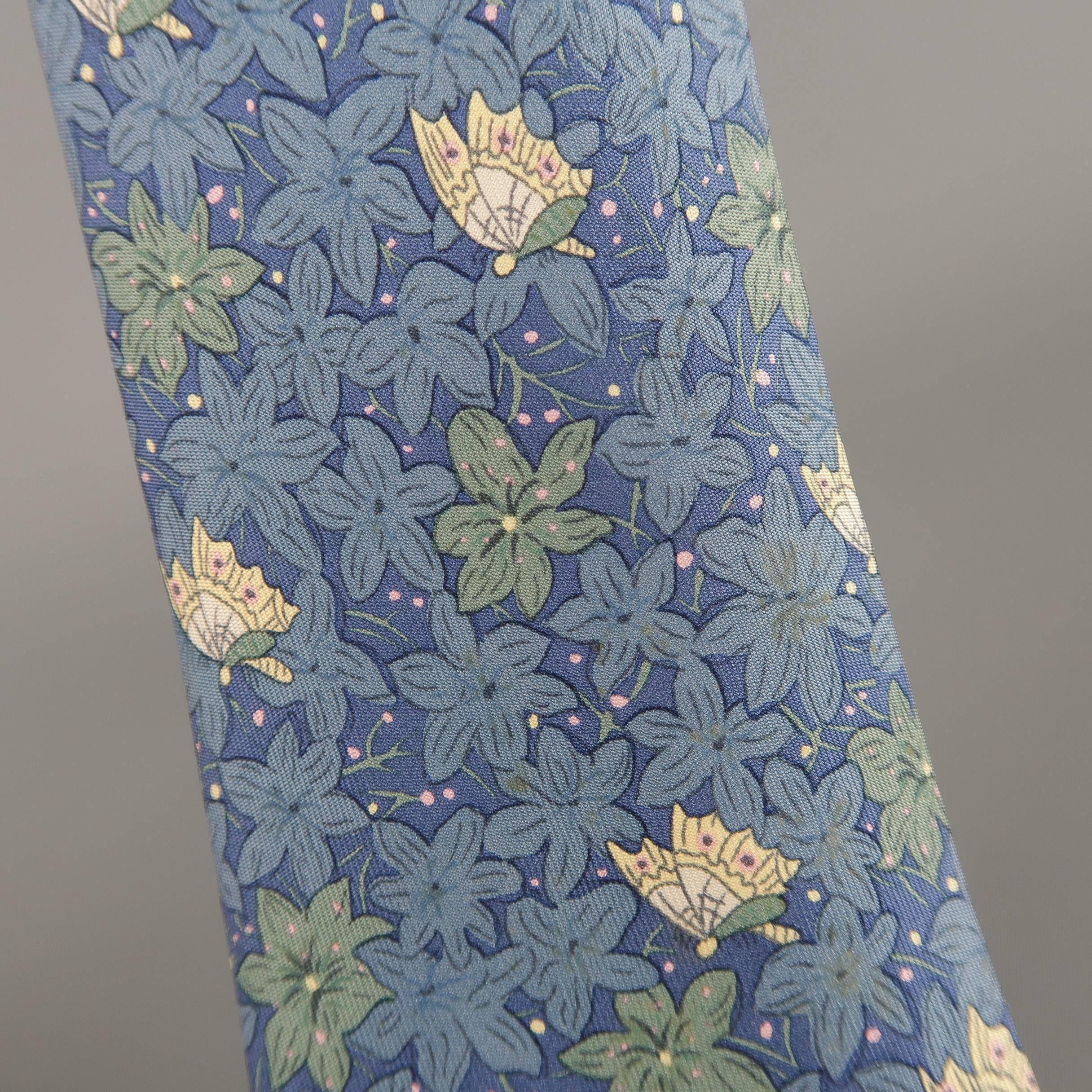 Vintage HERMES necktie comes in muted blue silk twill with all over teal and beige flower and butterfly print. Stains throughout. As-is. Made in France.
 
Fair Pre-Owned Condition.
 
Width: 3 in.
