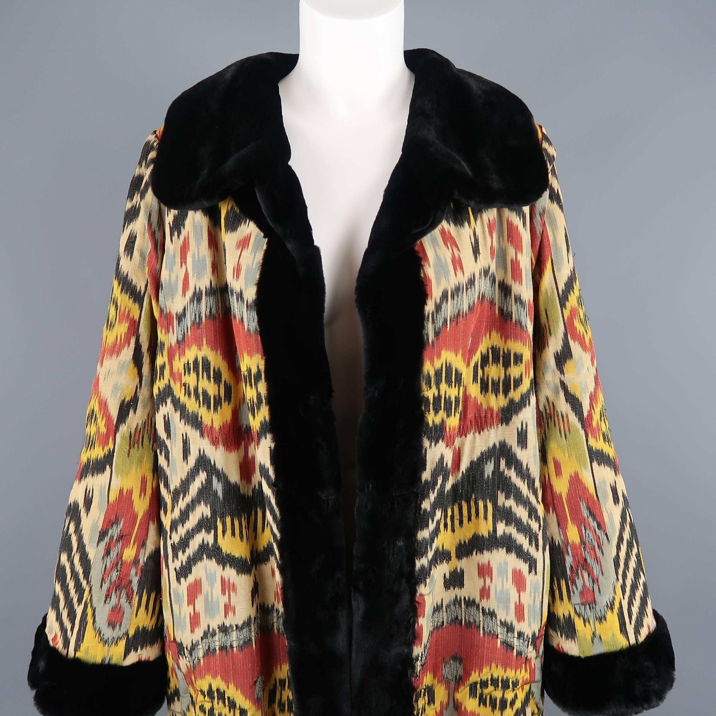 This stunning archive Oscar De La Renta reversible open front coat comes in a multi-color Ikat print silk Oscar used since his days at Balmain, with a black trimmed mink spread collar and trimmed cuffs with a reverse all sheared mink side completely