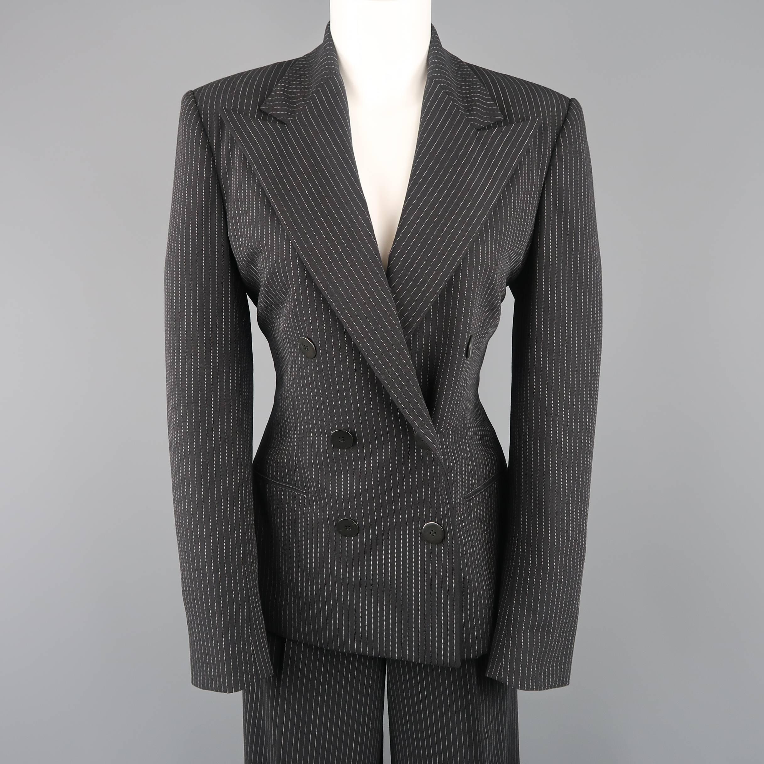 Ralph Lauren Collection suit comes in black pinstripe wool and includes a double breasted, peak lapel jacket and matching high rise, pleated, wide leg trousers. Made in USA.
 
Excellent Pre-Owned Condition.
Marked: Jacket: 6 /  Pants: 8
