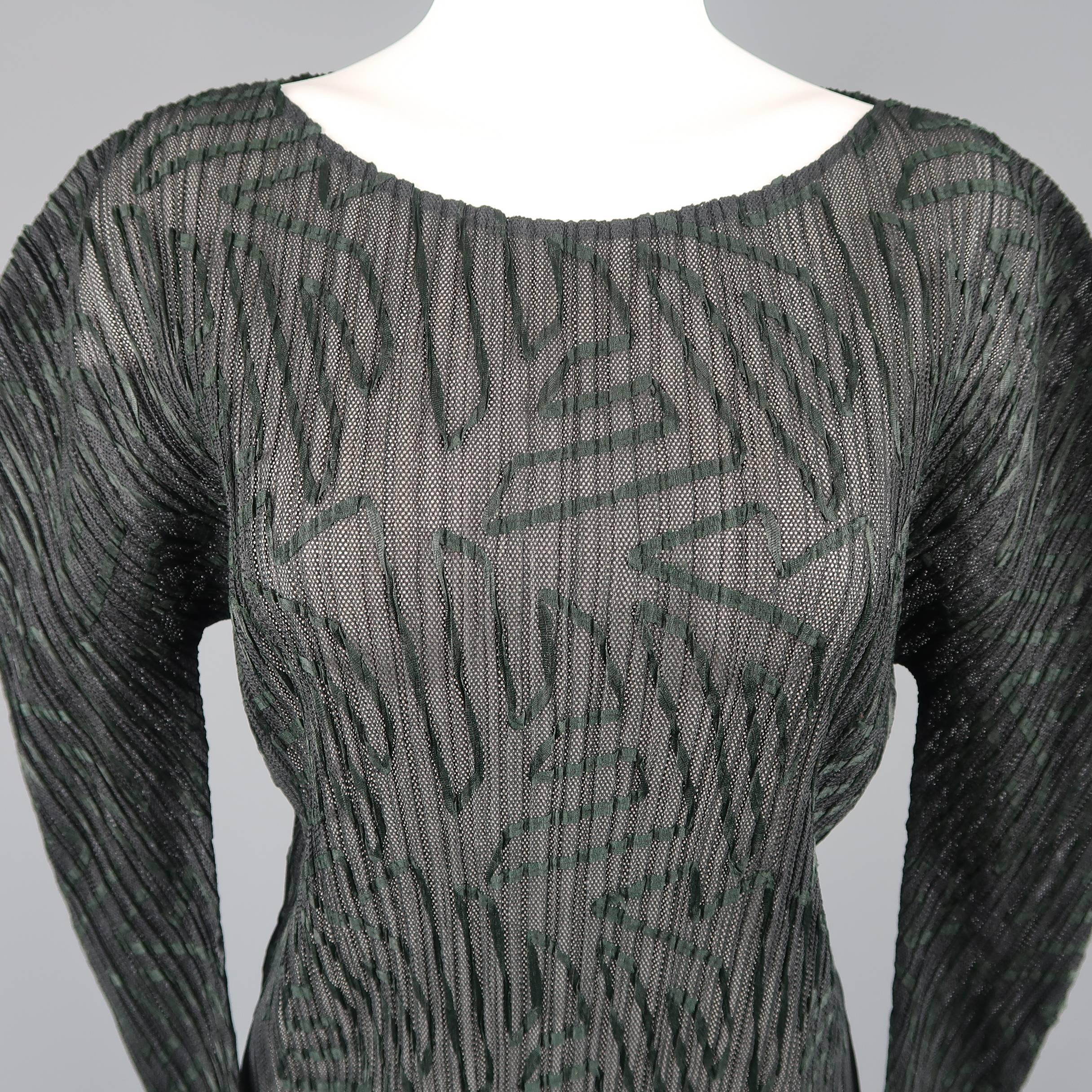 Issey Miyake  top comes in pleated black mesh with all over deep green ribbon pattern applique throughout, wide neck, and curved sleeves. Made in Japan.
 
Excellent Pre-Owned Condition.
Marked: M
 
Measurements:
 
Shoulder: 16 in.
Bust: 36