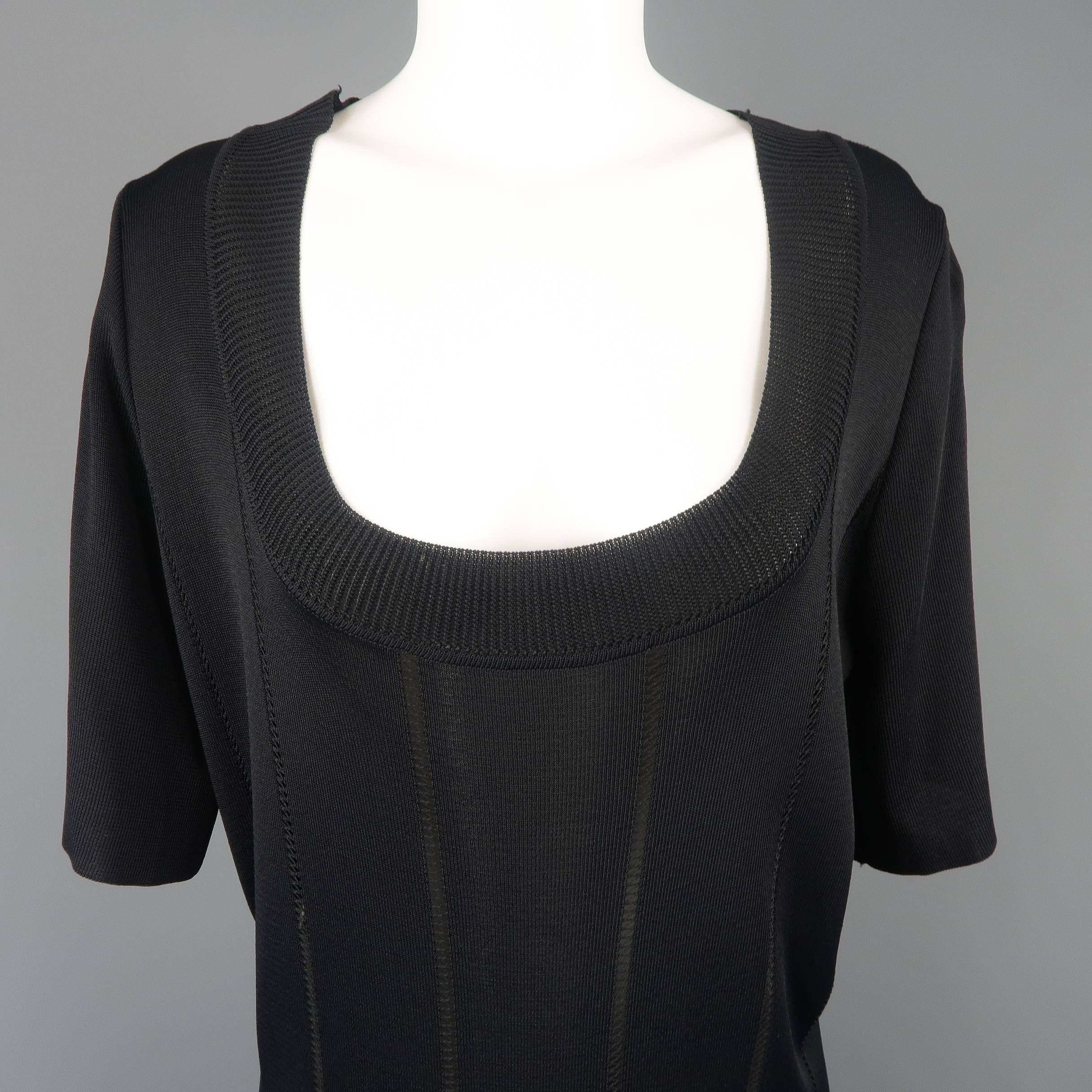 Vintage Claude Montana sweater mini dress comes in black knit with sheer stripes, a deep scoop neck, short sleeves, and thick fringe hem. Made in Italy.
 
Excellent Pre-Owned Condition.
Marked:  42
 
Measurements:
 
Shoulder: 16 in.
Bust: 44