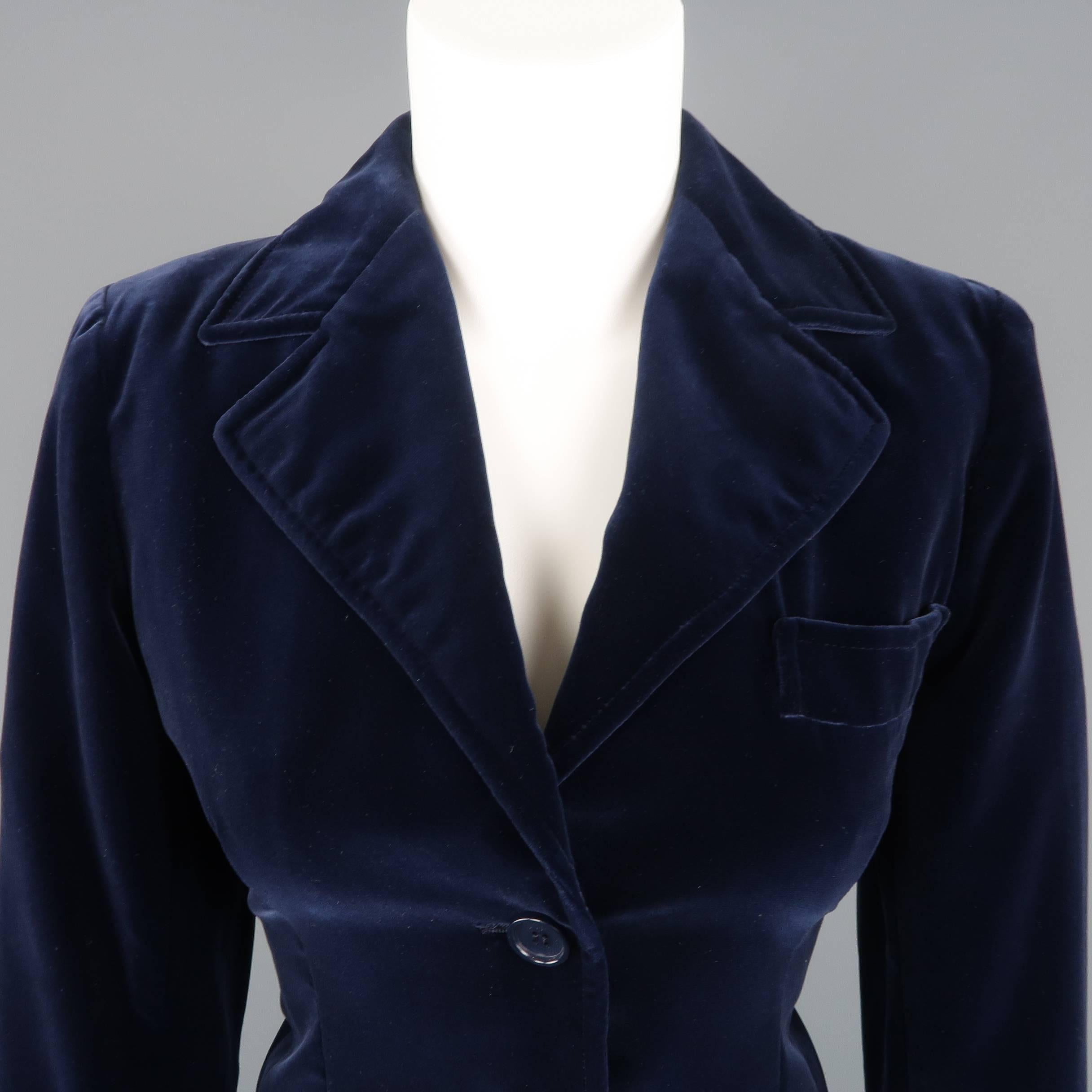 Vintage Yves Saint Laurent Rive Gauche sport coat comes in cotton blend velvet with a three button front, pointed lapel and patch pockets. Minor wear. Made in France.
 
Good Pre-Owned Condition.
Marked: FR 38
 
Measurements:
 
Shoulder: 15 in.
Bust: