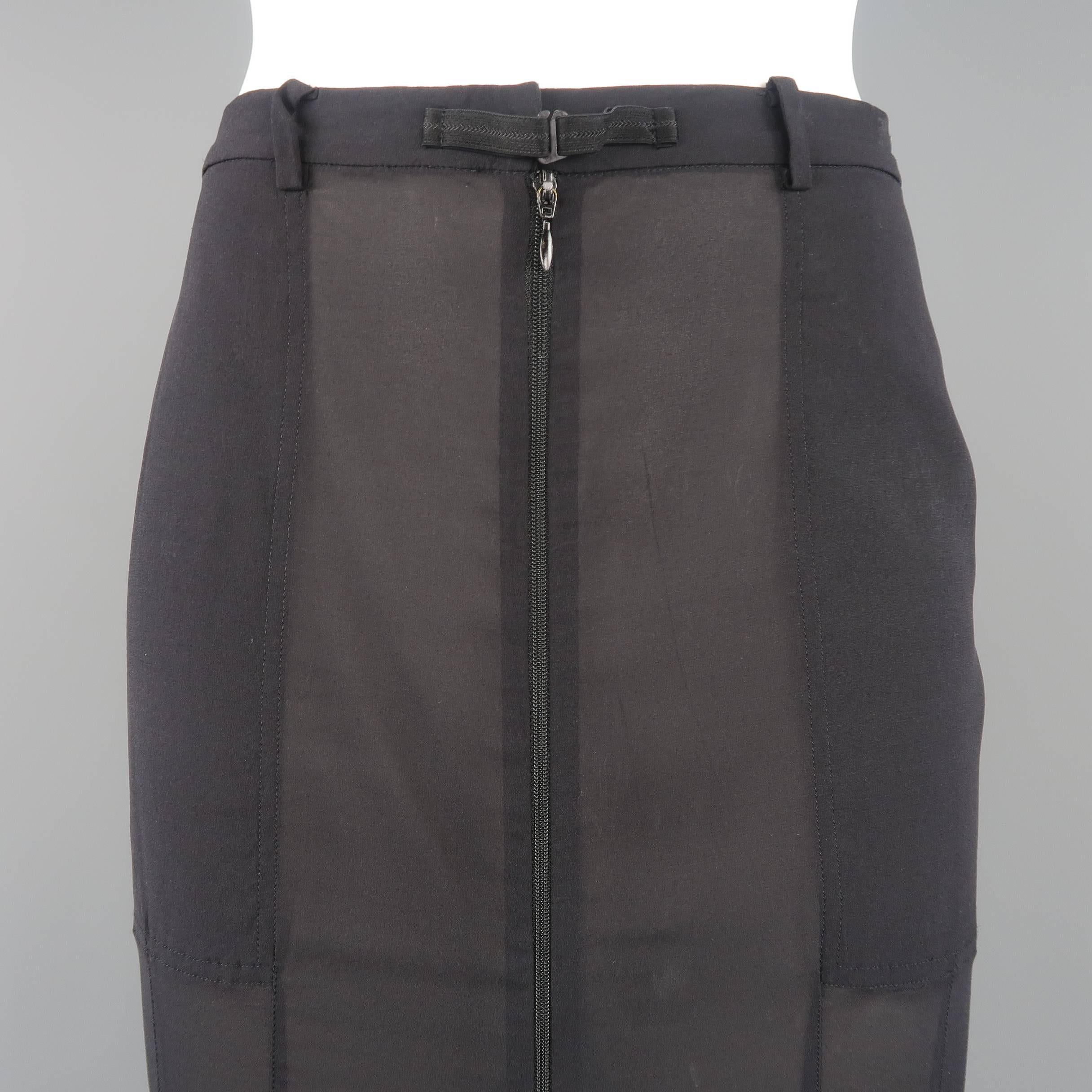 Dolce & Gabbana long pencil skirt comes in a light weight sheer stretch chiffon with a high rise, zipper piping details, back zip pockets, and zip fishtail silhouette. Tags removed. Wear throughout material. As is. Made in Italy.
 
Fair Pre-Owned