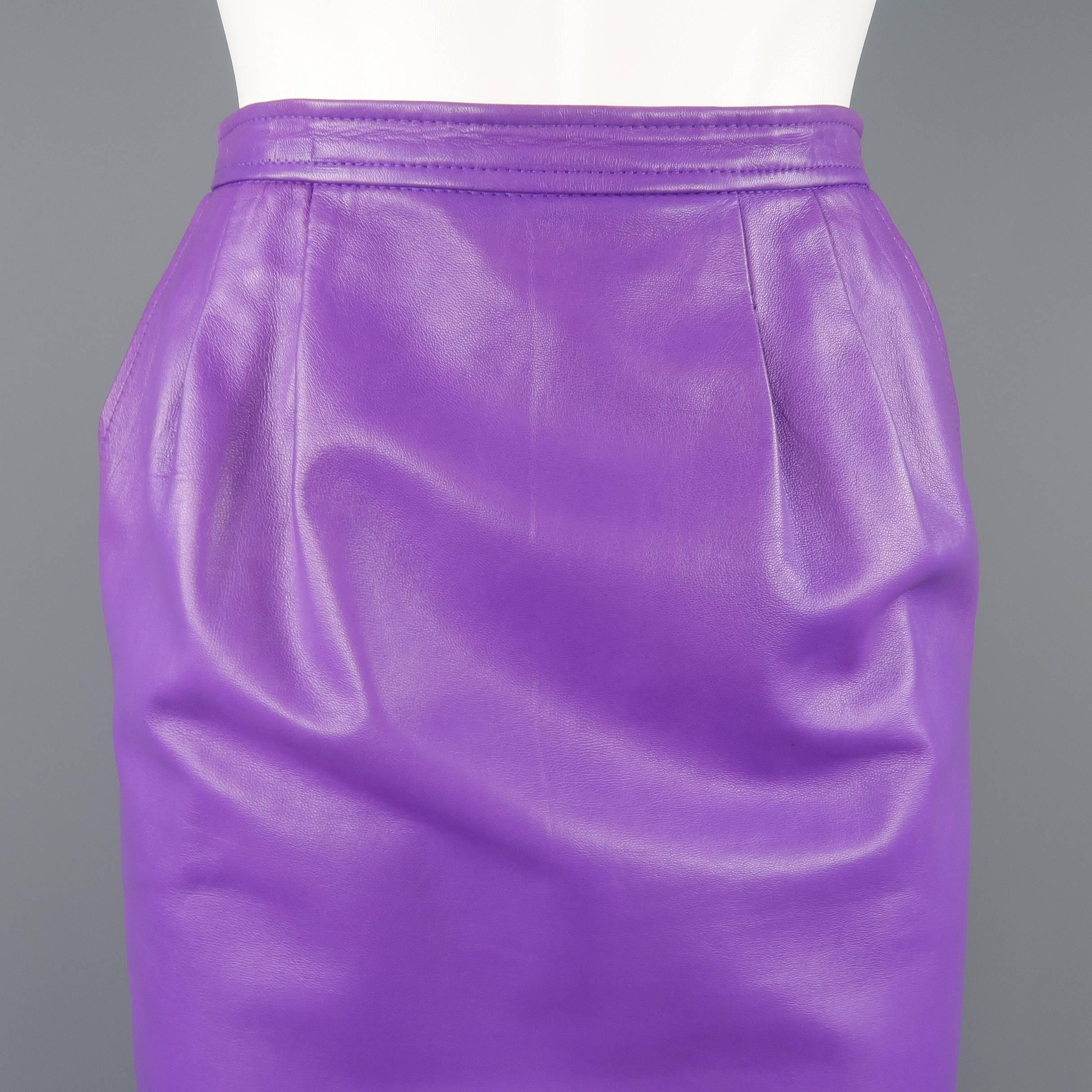 Vintage 1980's YVES SAINT LAURENT RIVE GAUCHE pencil skirt comes in vibrant purple soft leather with a high rise, slanted pockets, pleated waist, and satin liner. Faint discoloration throughout. As-is. Made in France.
 
Good Pre-Owned