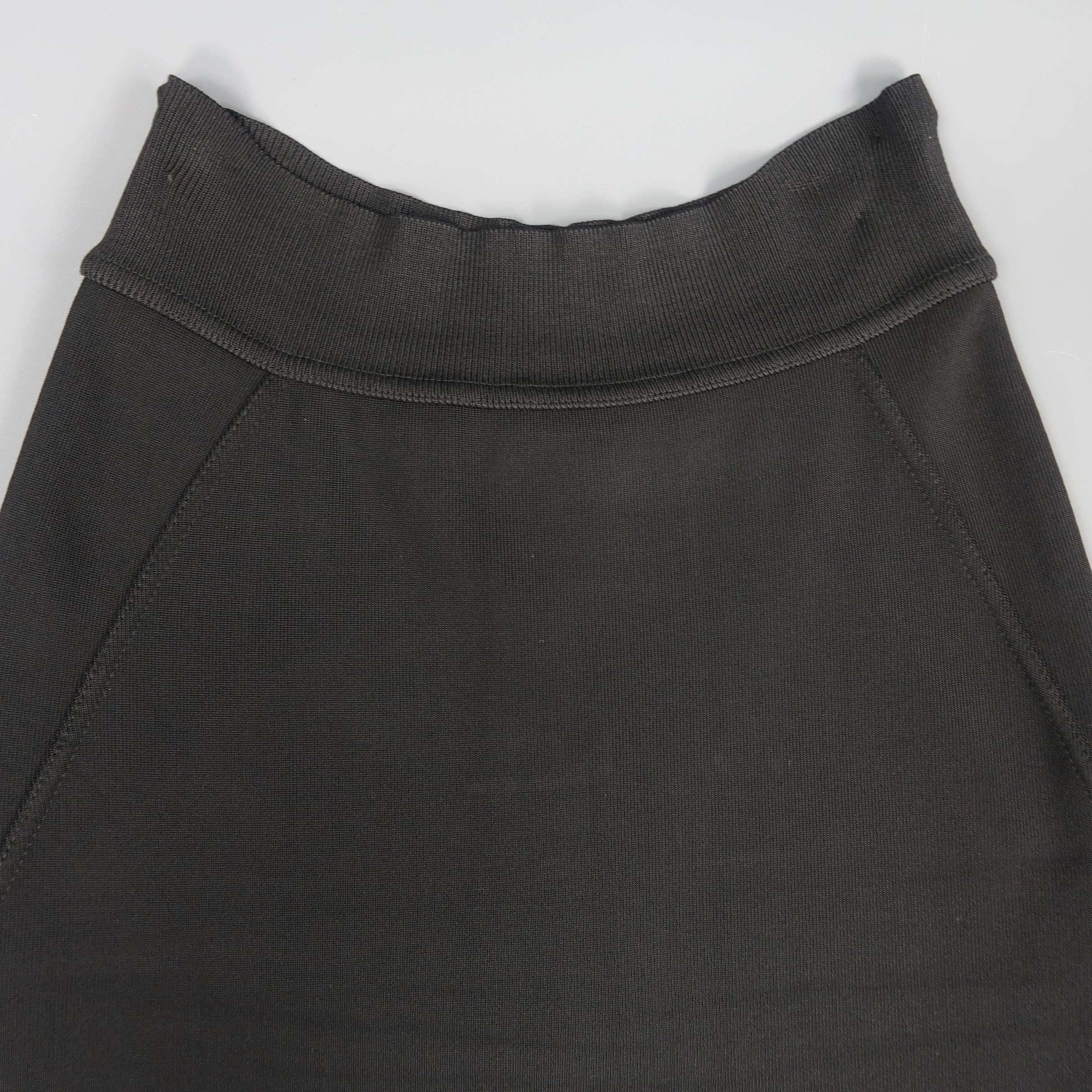 Vintage ALAIA bodycon pencil skirt comes in black stretch rayon knit with a high rise, side panels, and thick waistband. Made in Italy.
 
Good Pre-Owned Condition.
Marked: S
 
Measurements:
 
Waist: 24 in.
Hip: 31 in.
Length: 21 in.
