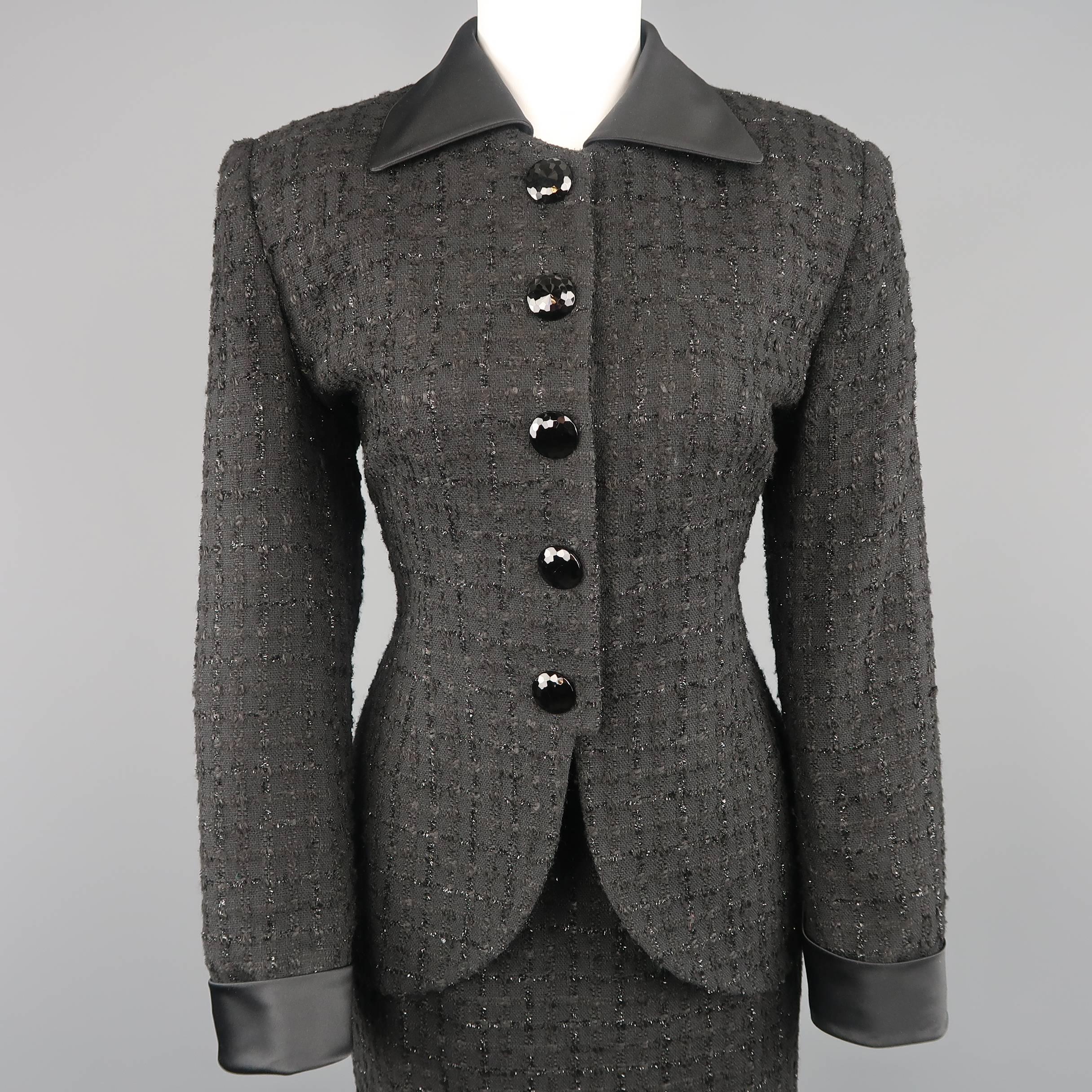 Vintage CHRISTIAN DIOR suit comes in black on black plaid boucle with lurex stripes and includes a tailored jacket with five oversized crystal buttons and detachable silk satin collar and cuffs with matching skirt. Made in USA.
 
Excellent Pre-Owned
