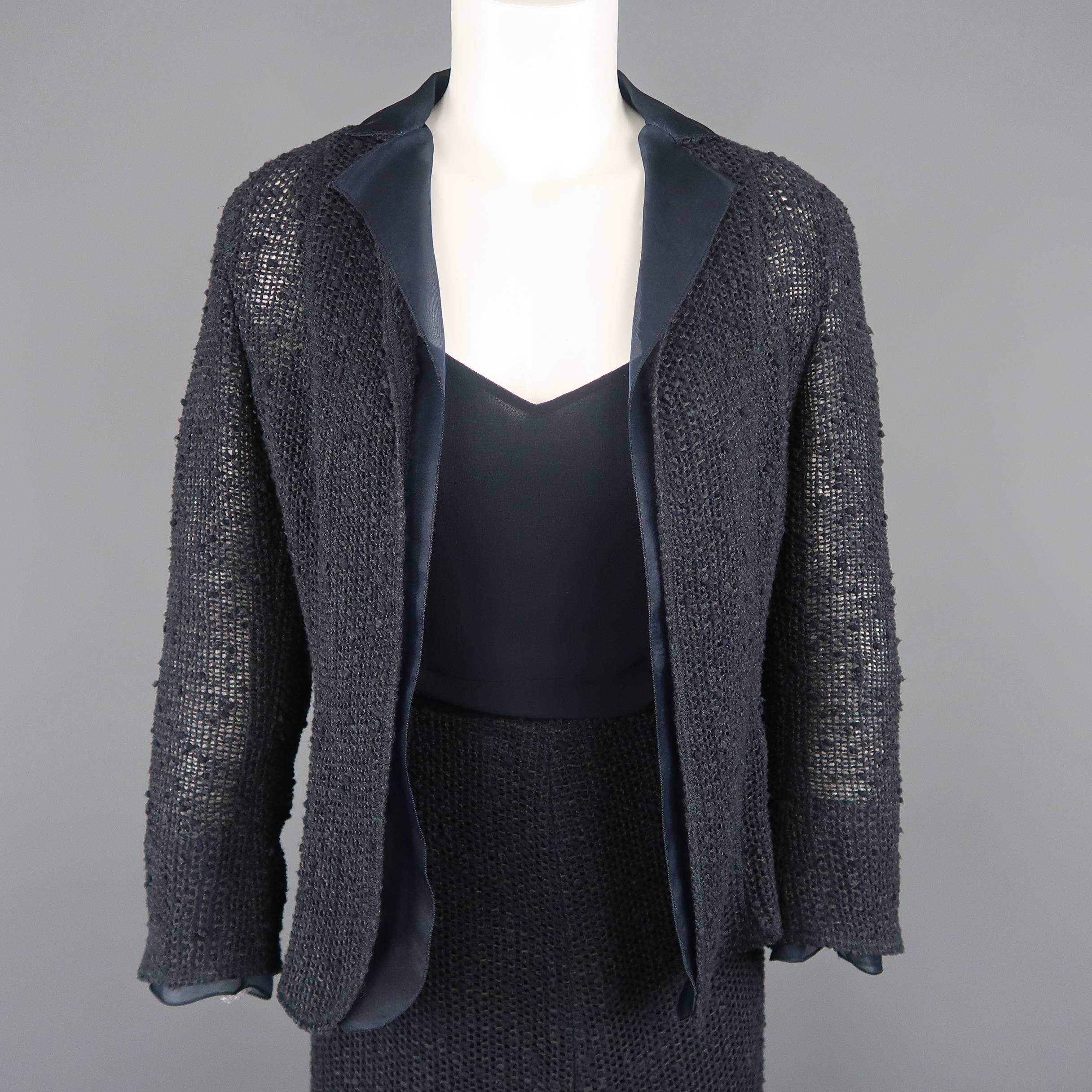 AKRIS ensemble comes in a textured mesh knit and includes an open front jacket with chiffon lapel, chiffon camisole, and matching knit skirt.
 
Excellent Pre-Owned Condition.
Marked: US 6
 
Measurements:
 
-Jacket:
Shoulder: 15 in.
Bust: 36