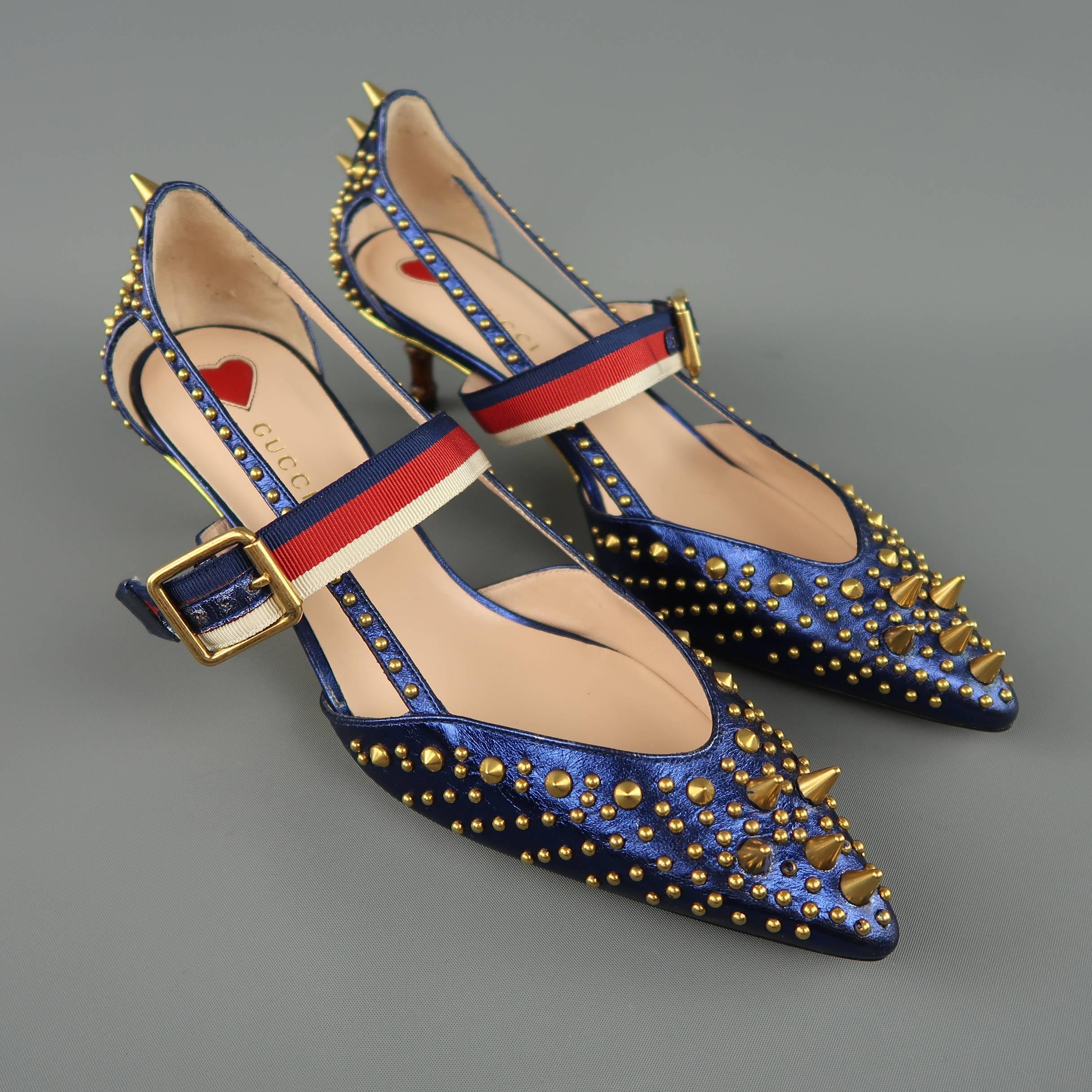 Gucci UNIA pumps come in metallic navy blue leather with gold tone studs and spikes, signature red, white, and blue striped strap, and faux bamboo kitten heel. Never worn. Made in Italy.
 
Brand New. Retails $1190
Marked: IT 38.5 
 
Heel: 2 in.
