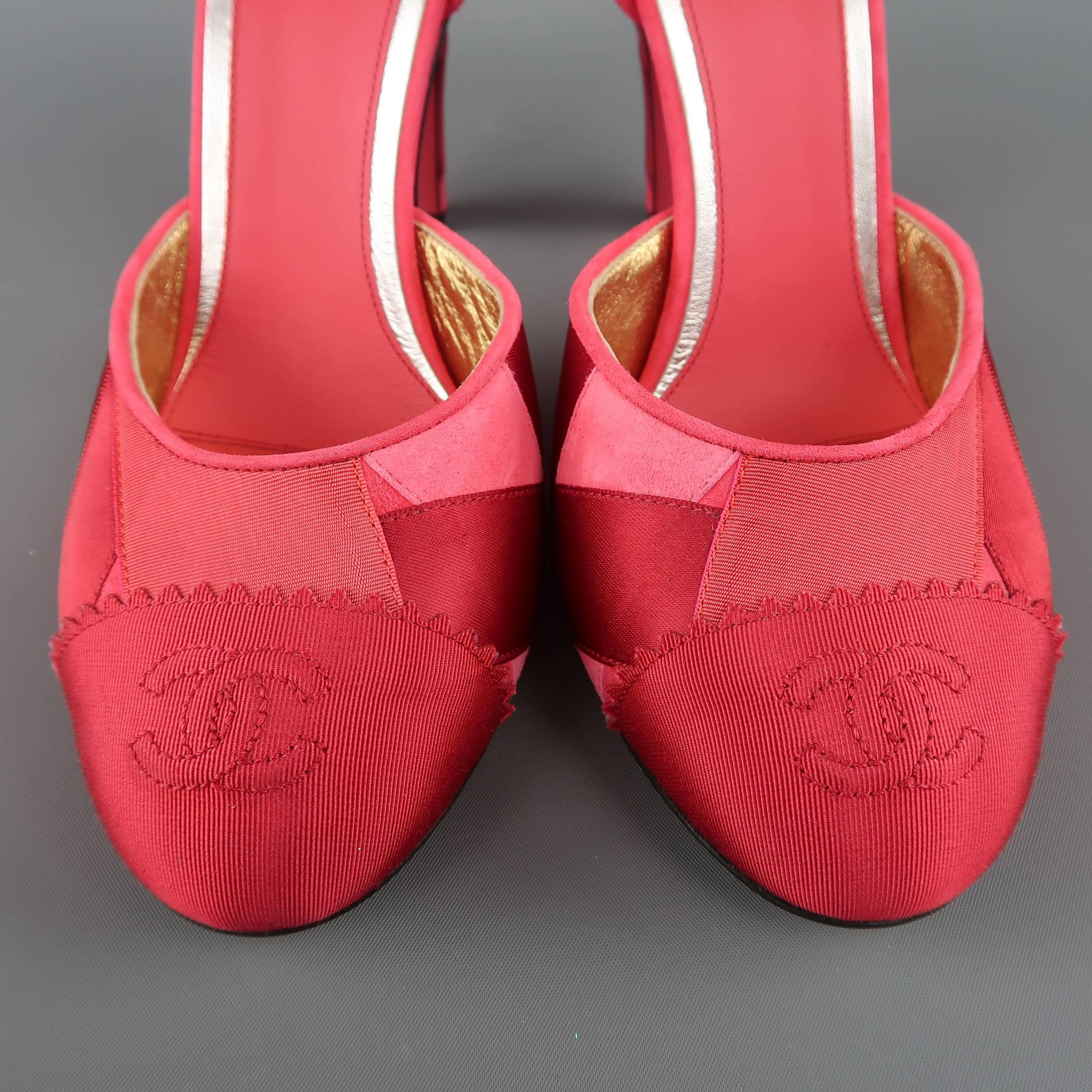 These beautiful CHANEL pumps come in suede with various shades of pink and burgundy silk grosgrain ribbon applique and feature a round toe with logo embroidered toe cap, covered heel, and ankle strap. Never worn. Made in Italy.
 
Brand New.
Marked: