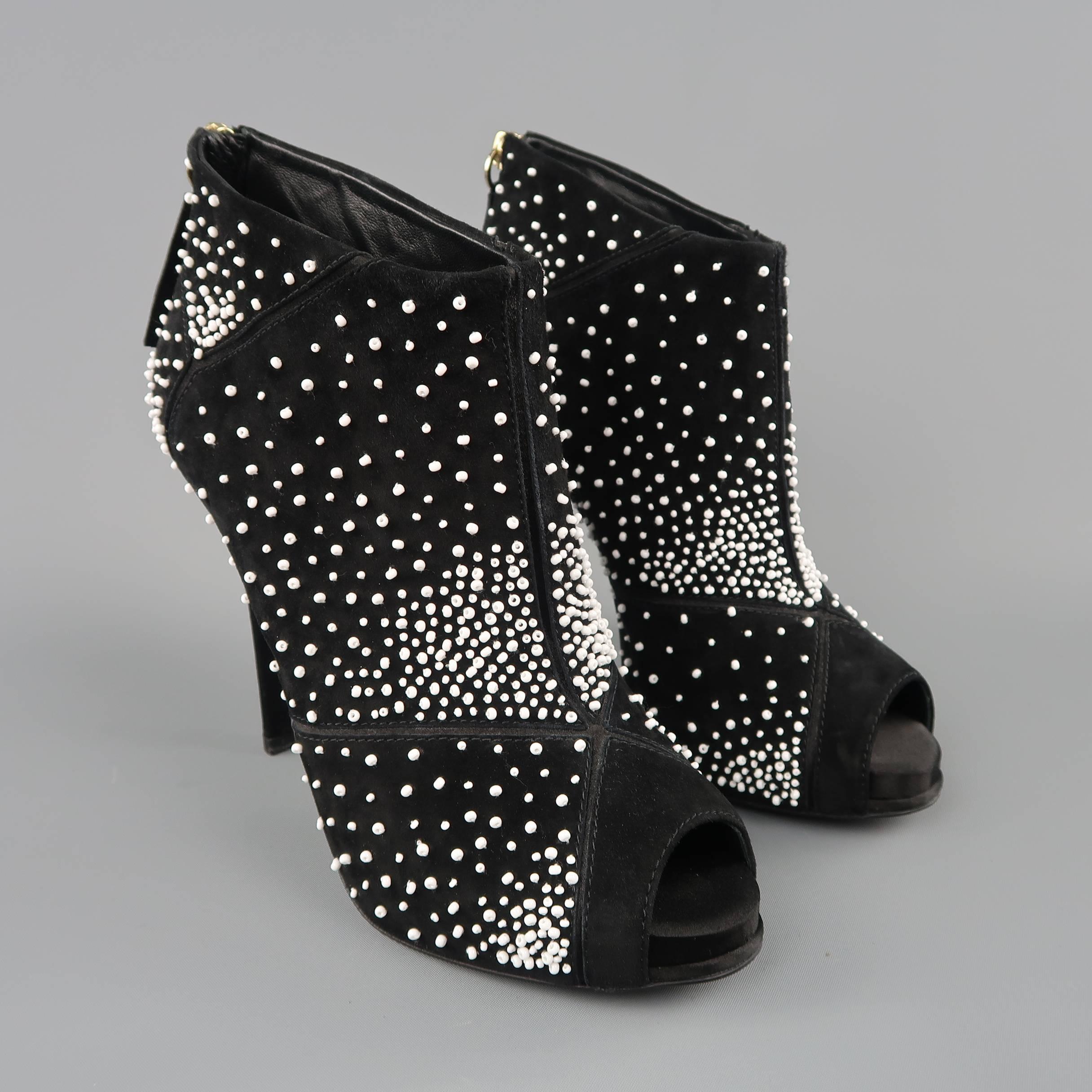 ROGER VIVIER booties come in black suede with silk satin details, peep toe, covered stiletto heel, and patchwork panels with white beadwork throughout. Worn once. Made in Italy.
 
Excellent Pre-Owned Condition.
Marked: IT 38.5
 
Heel: 4.5 in.
