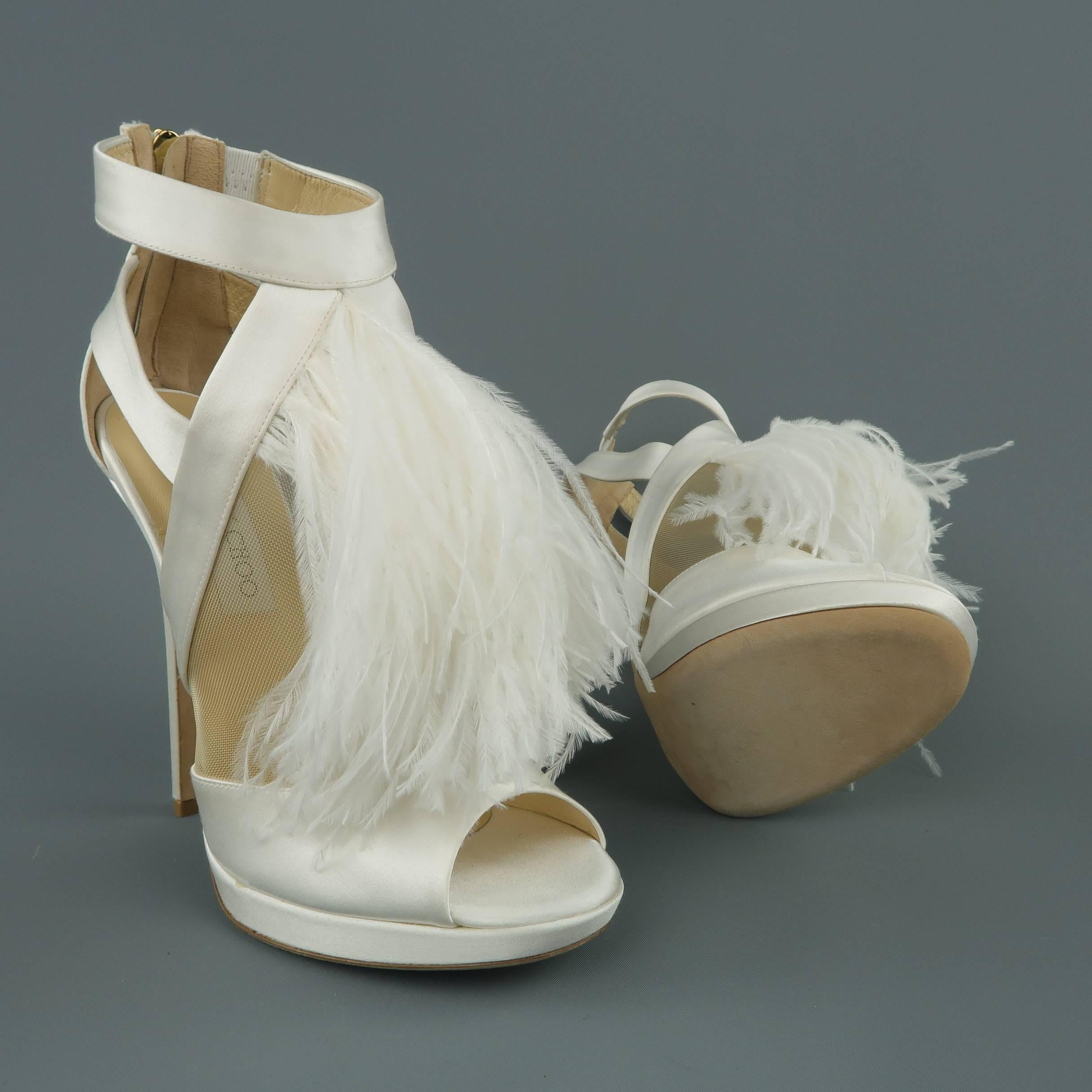 JIMMY CHOO Bridal sandals come in white silk satin with a peep toe, beige mesh side panels, covered platform and heel, and white ostrich feather adorned front. Never worn. Small scuff on heel from storage. As-is. Made in Italy.  Retailed: $1650
