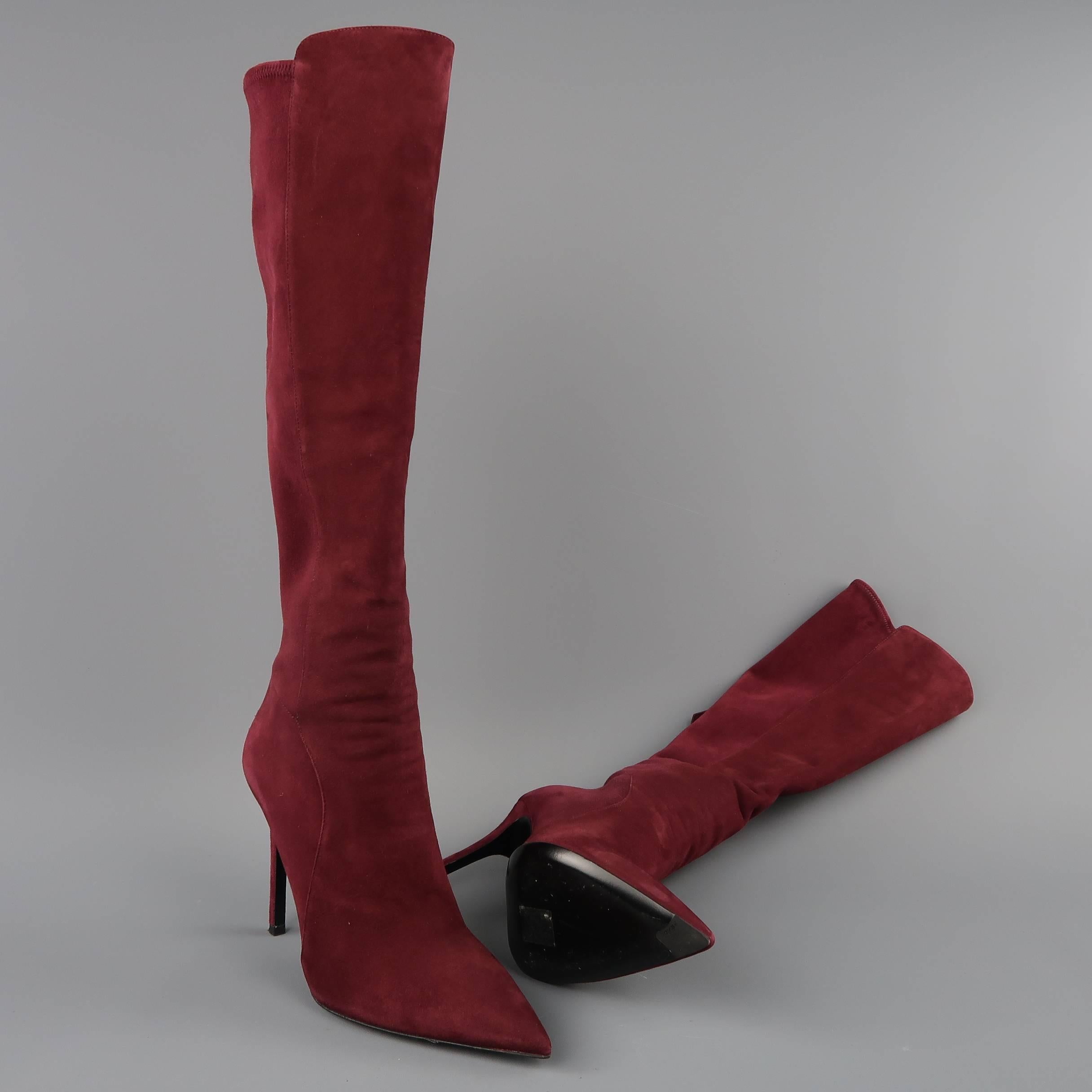 PRADA knee high boots come in burgundy suede with a pointed toe, covered stiletto heel, and back zip closure. Minor wear. Made in Italy.
 
Good Pre-Owned Condition.
Marked: IT 38.5
 
Measurements:
 
Heel: 4.25 in.
Length: 17 in.
