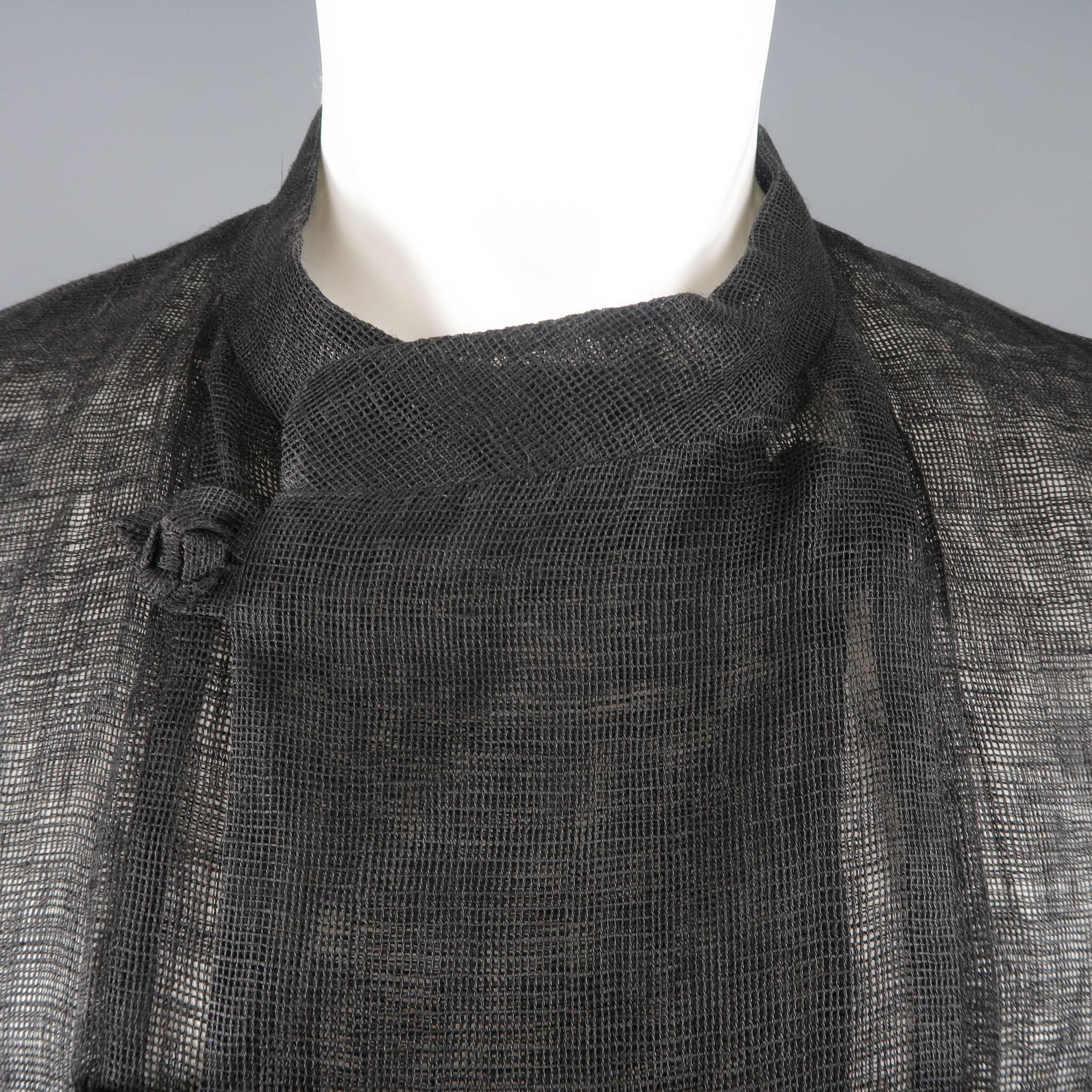 Vintage ISSEY MIYAKE jacket comes in woven linen mesh material with a band collar, double breasted toggle closure, oversized drop shoulder silhouette, and patch pockets. Made in Japan.
 
Good Pre-Owned Condition.
Marked: L
 
Measurements:
