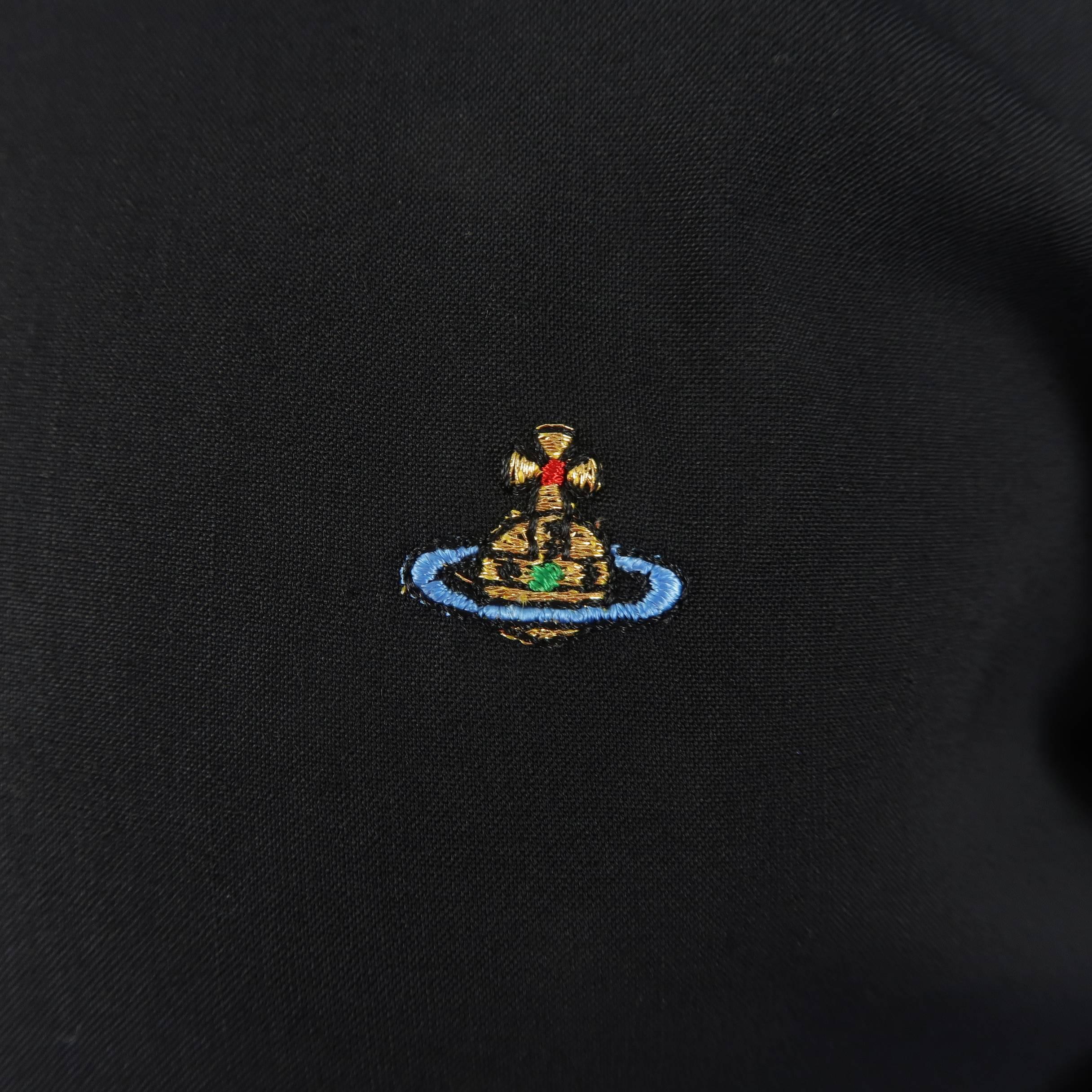 VIVIENNE WESTWOOD MAN shirt comes in black stretch wool gaberdine with an oversized, two button, pointed high collar, tan buttons, drop shoulder, curved sleeves, and mini orb embroidery on chest. Made in Italy.
 
Excellent Pre-Owned