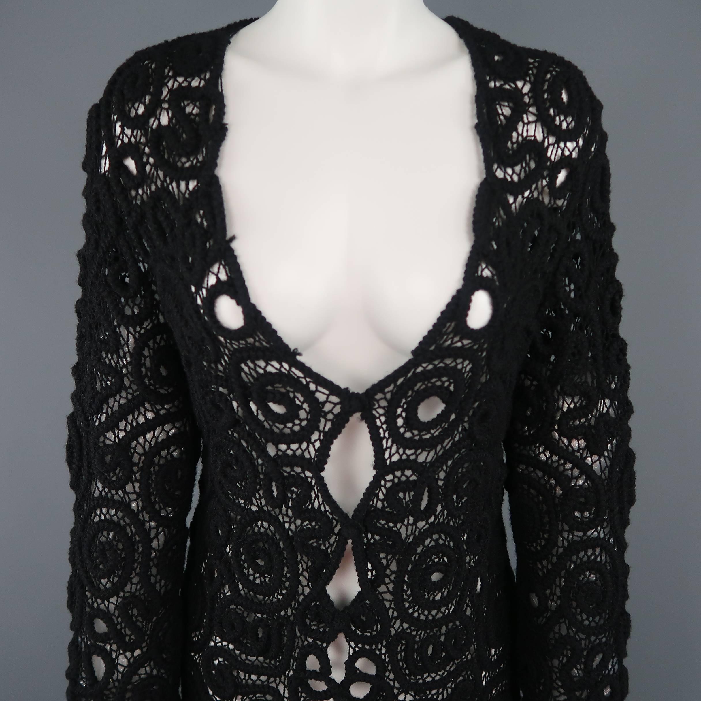 Vintage Matsuda cardigan comes in black wool lace crochet with a V neck and bi-level fringe hem. Minor wear. Made in Japan.
 
Good Pre-Owned Condition.
Marked: (no size)
 
Measurements:
 
Shoulder: 14 in.
Bust: 38 in.
Sleeve: 27 in.
Length: 35-41