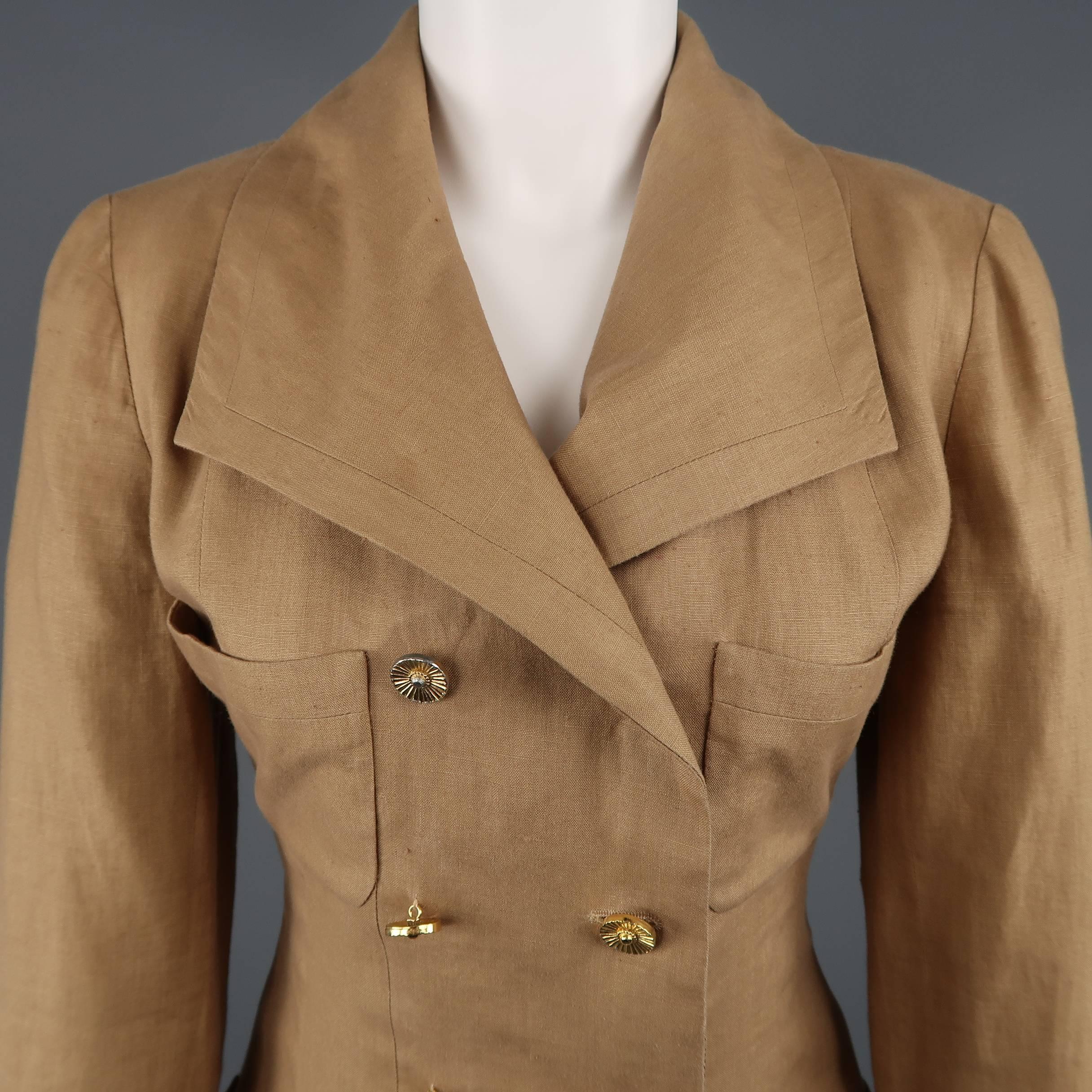 Vintage CHANEL circa 1990 suit comes in tan linen and includes a double breasted jacket with pointed lapel, four patch pockets, and gold tone metal buttons with a matching button side skirt. Wear throughout including stain on inner lapel and