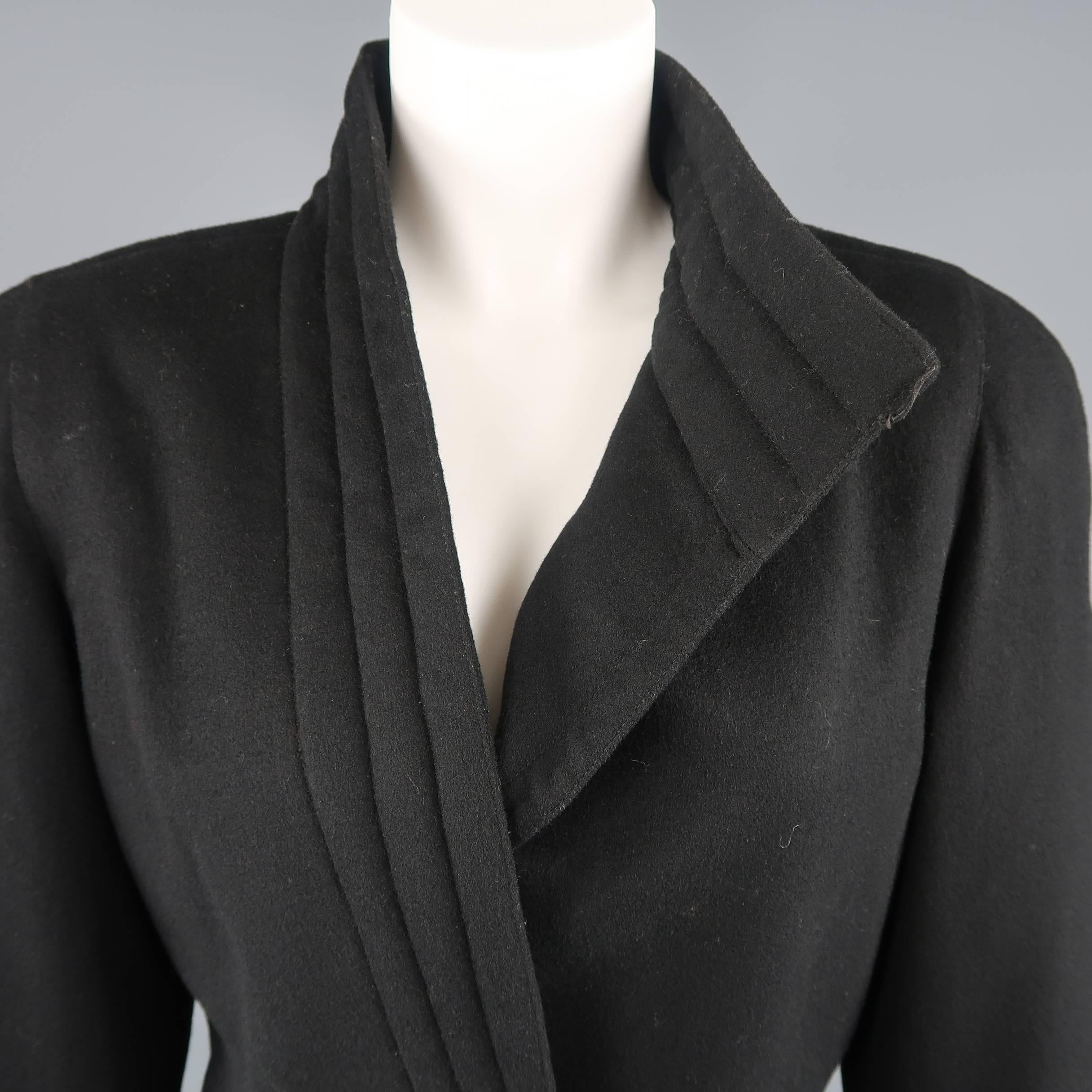 Vintage 1980's Gianni Versace  jacket comes in black felt and features a quilted asymmetrical collar closure with gold tone metal button, strong shoulders, and slit pockets. Made in Italy.
 
Good Pre-Owned Condition.
Marked: (no size)
