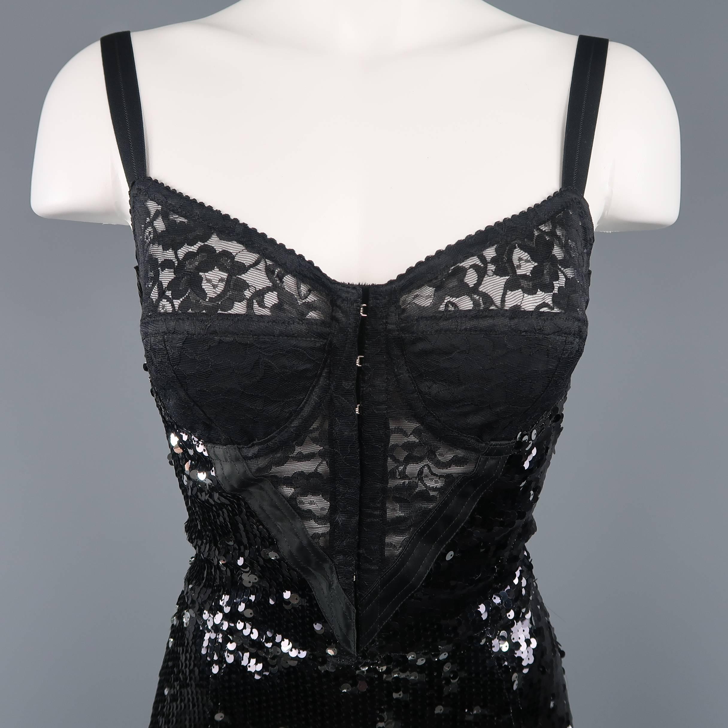 Dolce & Gabbana  Fall Winter 2011 bodysuit comes in black with silver reverse side mini payette stretch sequins fabric with a retro style lace bra, V corset panel, metal boning, and stretch back panel. Shorts sewn in added by consignor. Easily