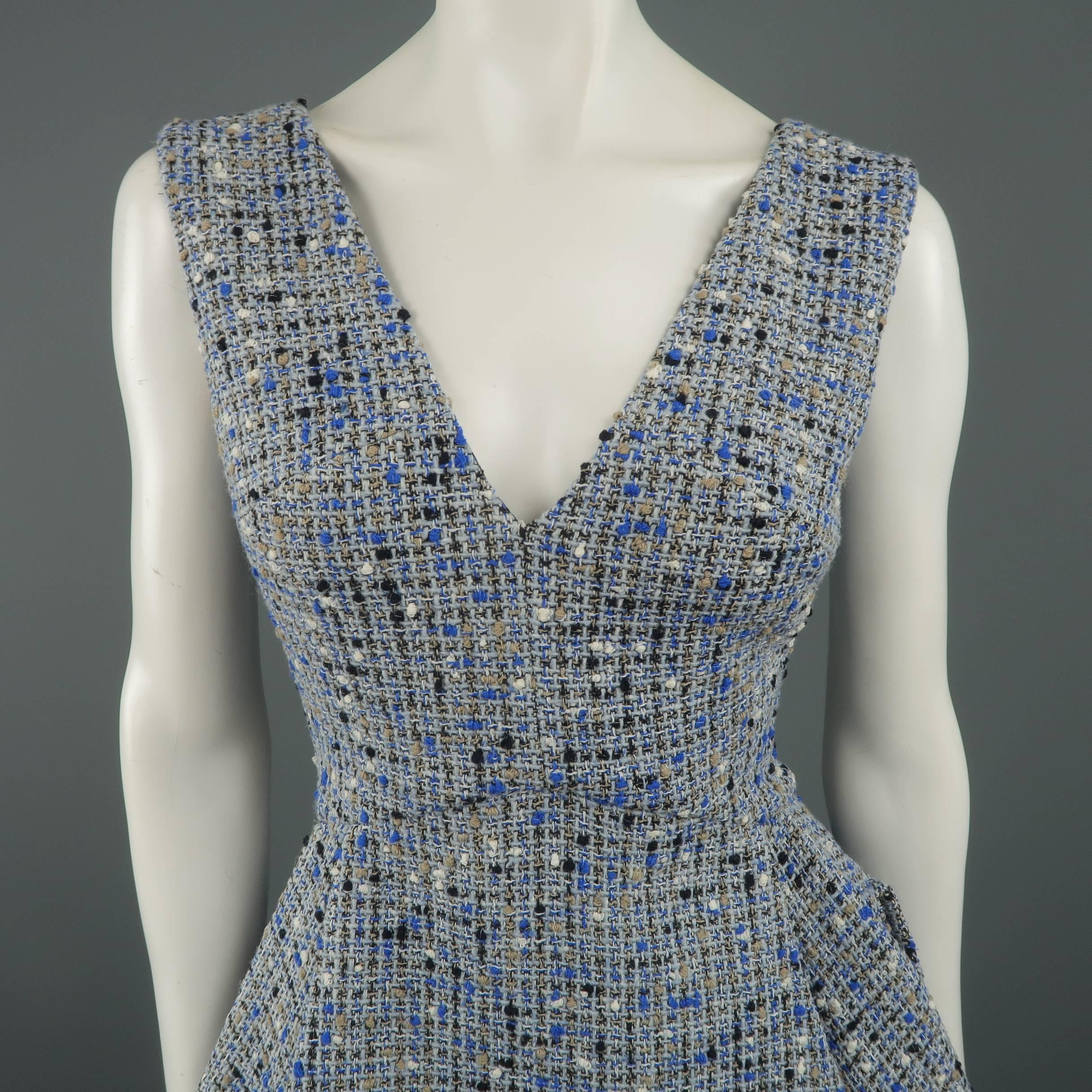 Christian Dior Resort 2016 cocktail dress comes in light blue wool blend tweed with hues of beige and black and features a V neckline, pleated flair A line skirt, and double back pockets. Made in France.
 
Excellent Pre-Owned Condition.
Marked: 6
