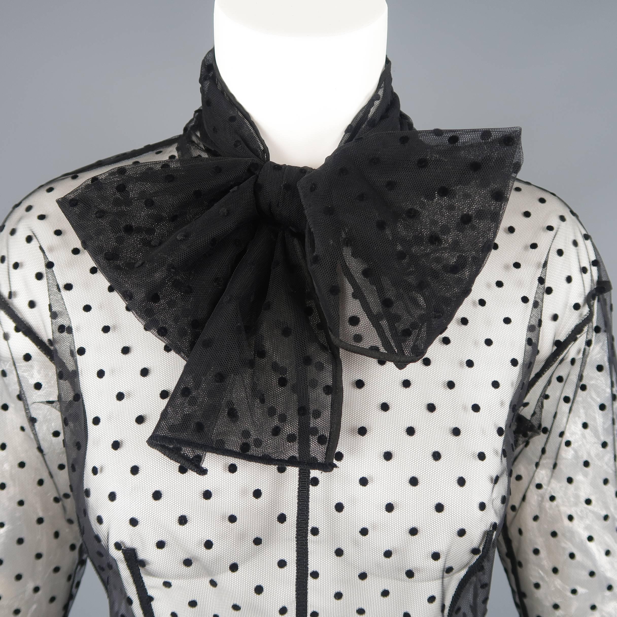 Marc Jacobs blouse comes in silk polka dot tulle mesh with grosgrain piping, hidden back zipper, and oversized bow collar. Made in Italy.
 
Good Pre-Owned Condition.
Marked: 0
 
Measurements:
 
Shoulder: 18 in.
Bust: 32 in.
Sleeve: 23 in.
Length: 20