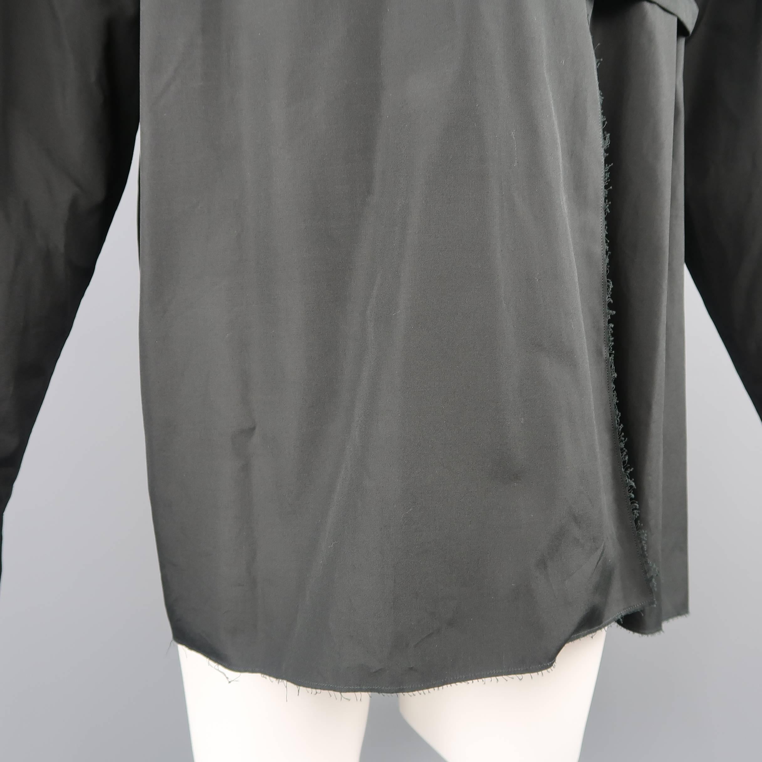 Marni oversized shirt comes in classic cotton fabric with raw frayed edges, v neck with folded collar, and single button with internal strap closure. Made in Italy.
 
Excellent Pre-Owned Condition.
Marked: IT 48
 
Measurements:
 
Shoulder: 21