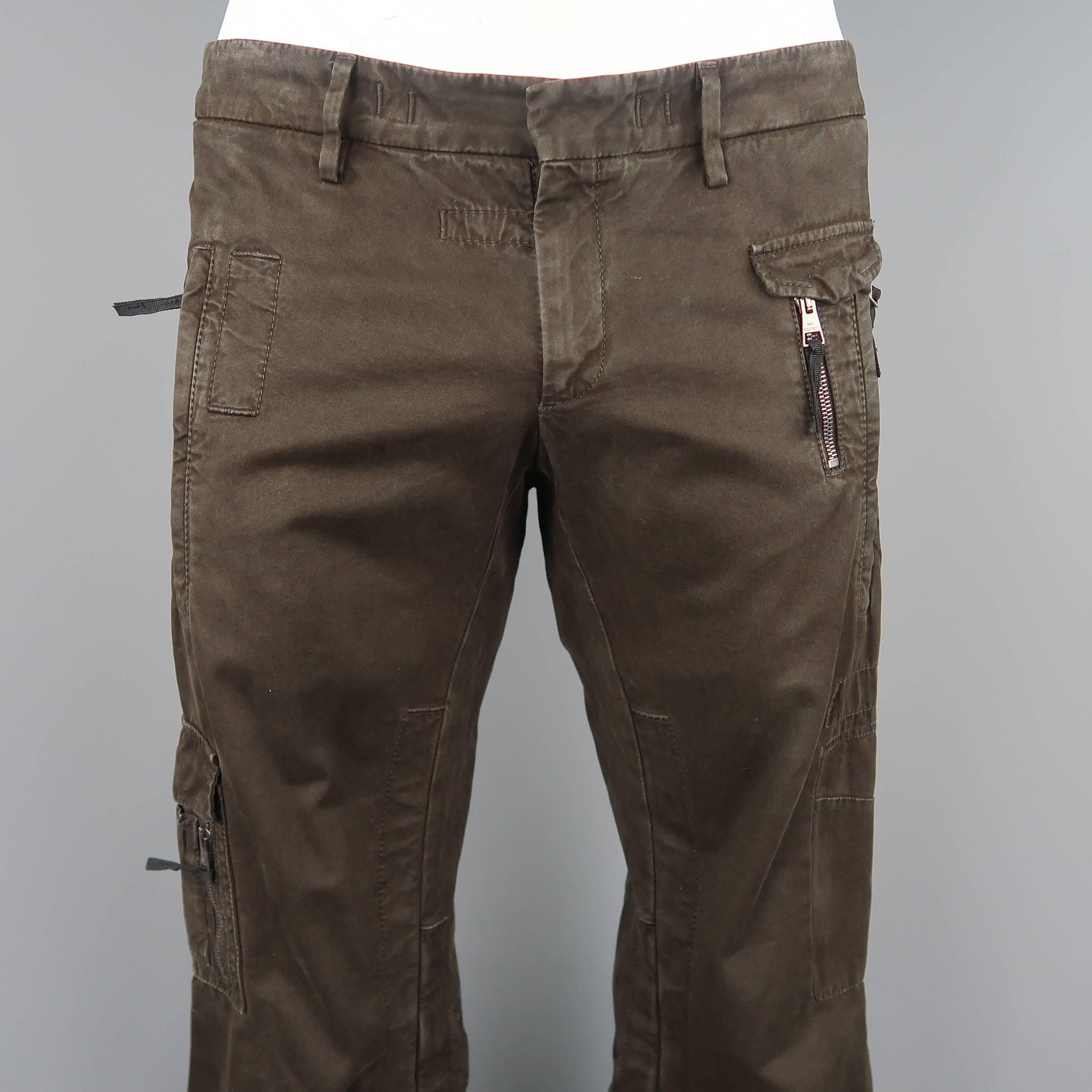 Neil Barrett pants come in chocolate brown cotton canvas with zip and cargo pockets. Made in Latvia.
 
Good Pre-Owned Condition.
Marked: IT 48
 
Measurements:
 
Waist: 34 in.
Rise: 11 in.
Inseam: 36 in.
