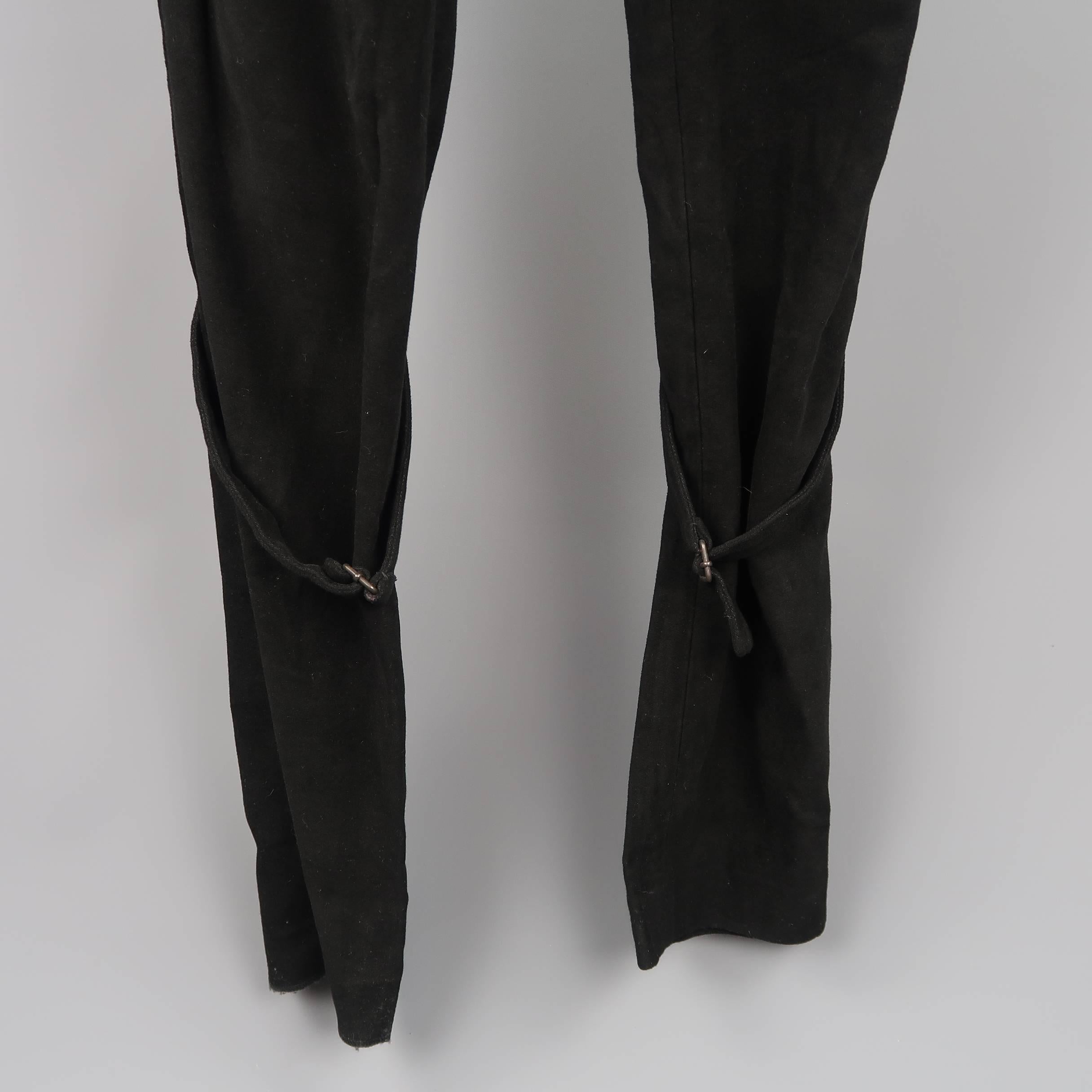 ANN DEMEULEMEESTER bondage pants come in black velvet side straps at the waistband and adjustable leg straps. One hem undone. As-is. Made in Belgium.
 
Good Pre-Owned Condition.
Marked: S
 
Measurements:
 
Waist: 33 in.
Rise: 9 in.
Inseam: 36 in.
