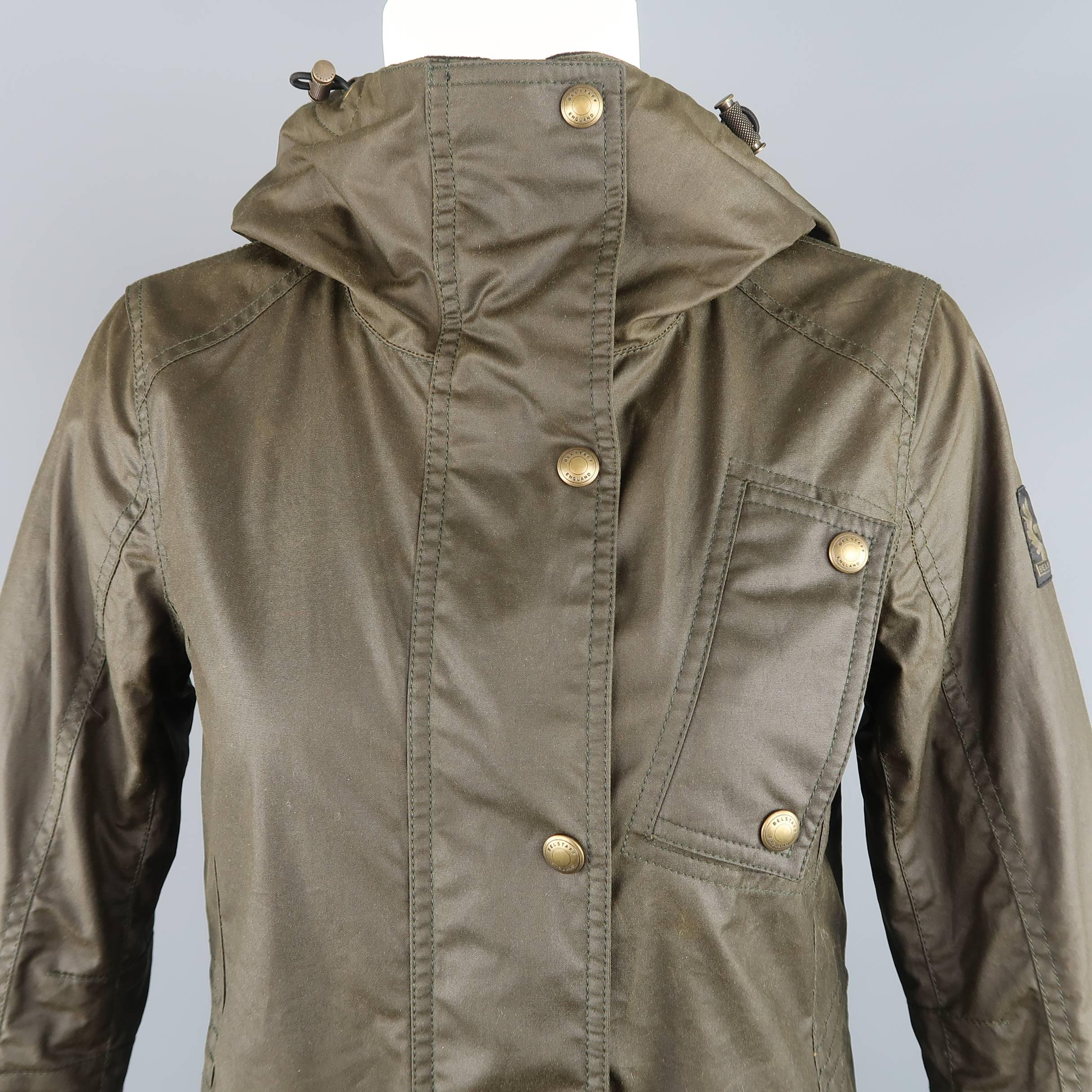 Belstaff parka comes in olive green coated cotton with snap placket zip closure, snap flap pockets, flannel liner, and drawstring hood. With tags. Fading throughout. As-is.
 
Good Pre-Owned Condition.
Marked: IT 38
 
Measurements:
 
Shoulder: 14