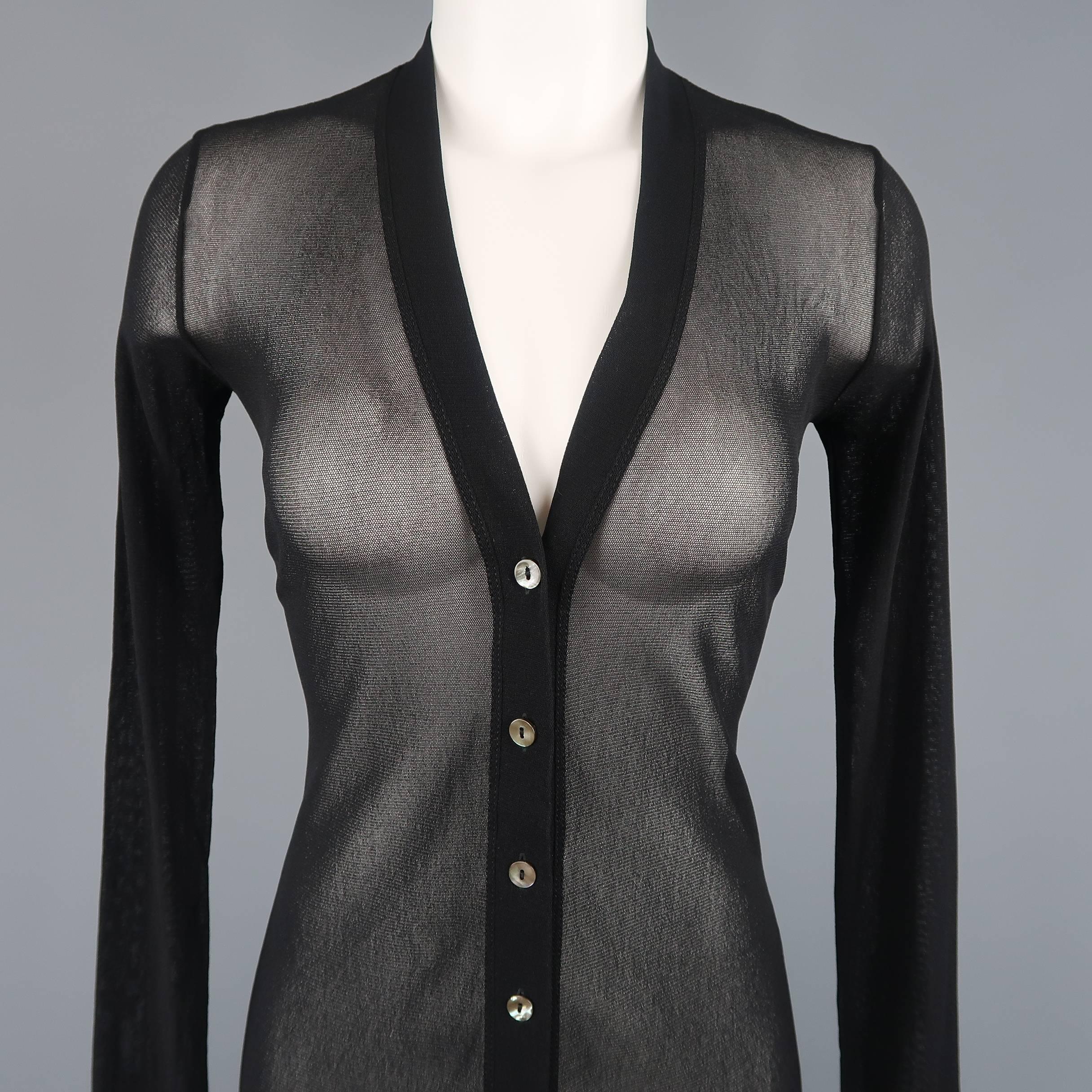 Jean Paul Gaultier Vintage long cardigan dress comes in black micro mesh with a deep V neck button up front. Made in Italy.
 
Excellent Pre-Owned Condition.
Marked: M
 
Measurements:
 
Shoulder:14.5 in.
Bust: 34 in.
Waist: 24 in.
Hip: 34 in.
Sleeve: