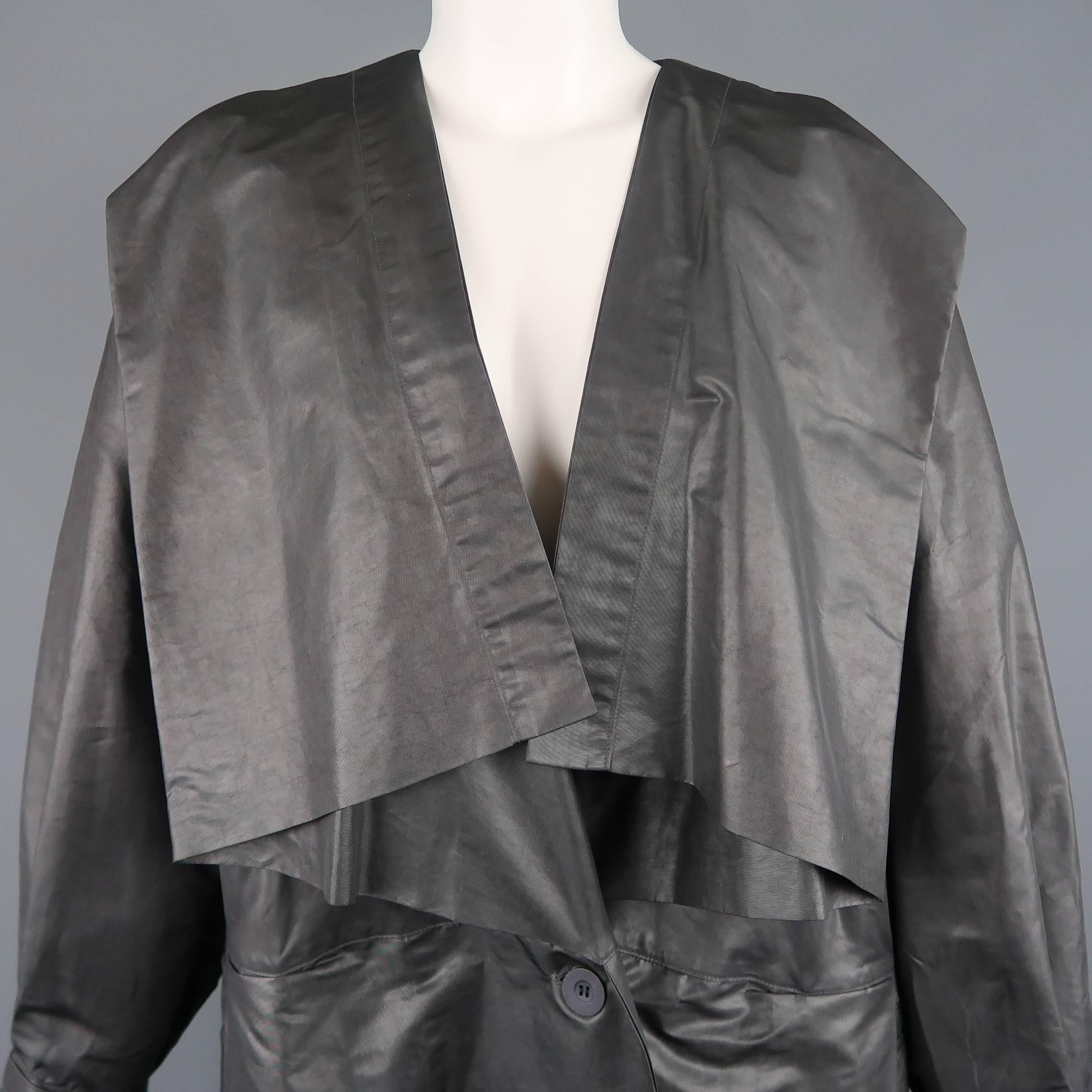 Vintage 1980's ISSEY MIYAKE coat comes in metallic polyester twill with a folded drape square collar, pleated front, slanted pockets, and sailor collar back. Without belt. As-is.  Made in Japan.
 
Good Pre-Owned Condition.
Marked: S
 
Measurements:
