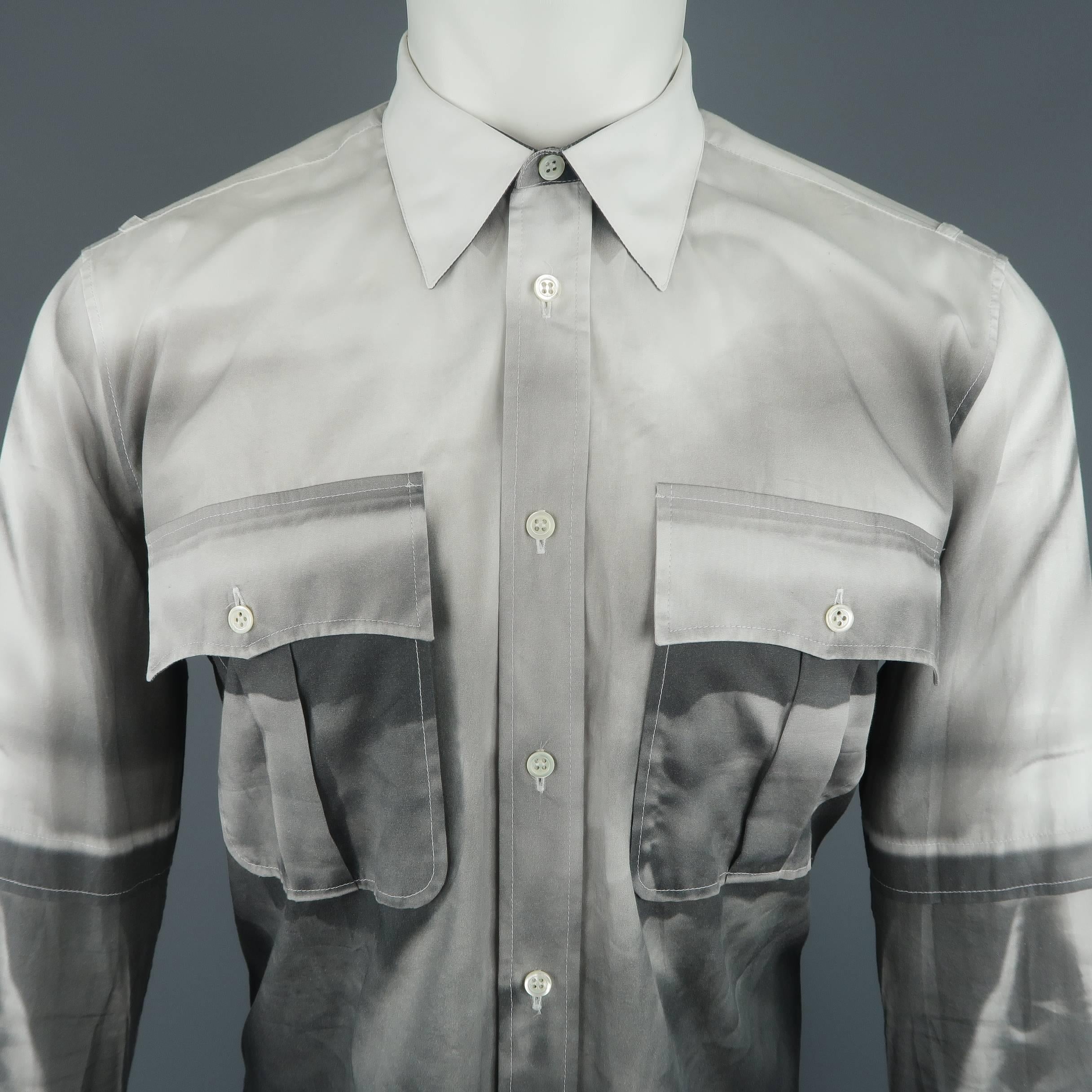 Alexander McQueen shirt comes in white cotton with patch flap pockets, shoulder straps, and all over photo print. Made in Italy.
 
Excellent Pre-Owned Condition.
Marked: IT 46
 
Measurements:
 
Shoulder: 17 in.
Chest: 50 in.
Sleeve: 26 in.
Length: