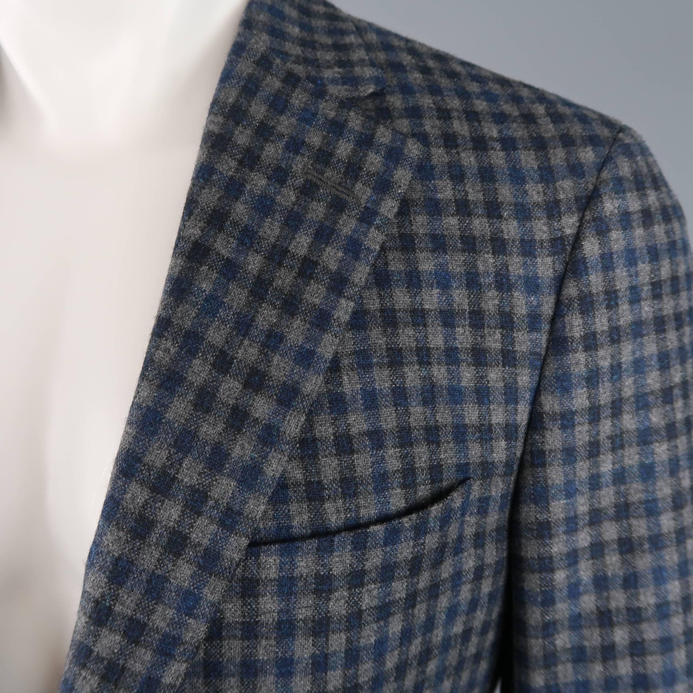 SAMUELSOHN sport coat comes in blue and gray plaid wool cashmere flannel with a notch lapel, two button closure, functional button cuffs, and half liner. Made in Canada.
 
Excellent Pre-Owned Condition.
Marked: 40 R
 
Measurements:
 
Shoulder: 17