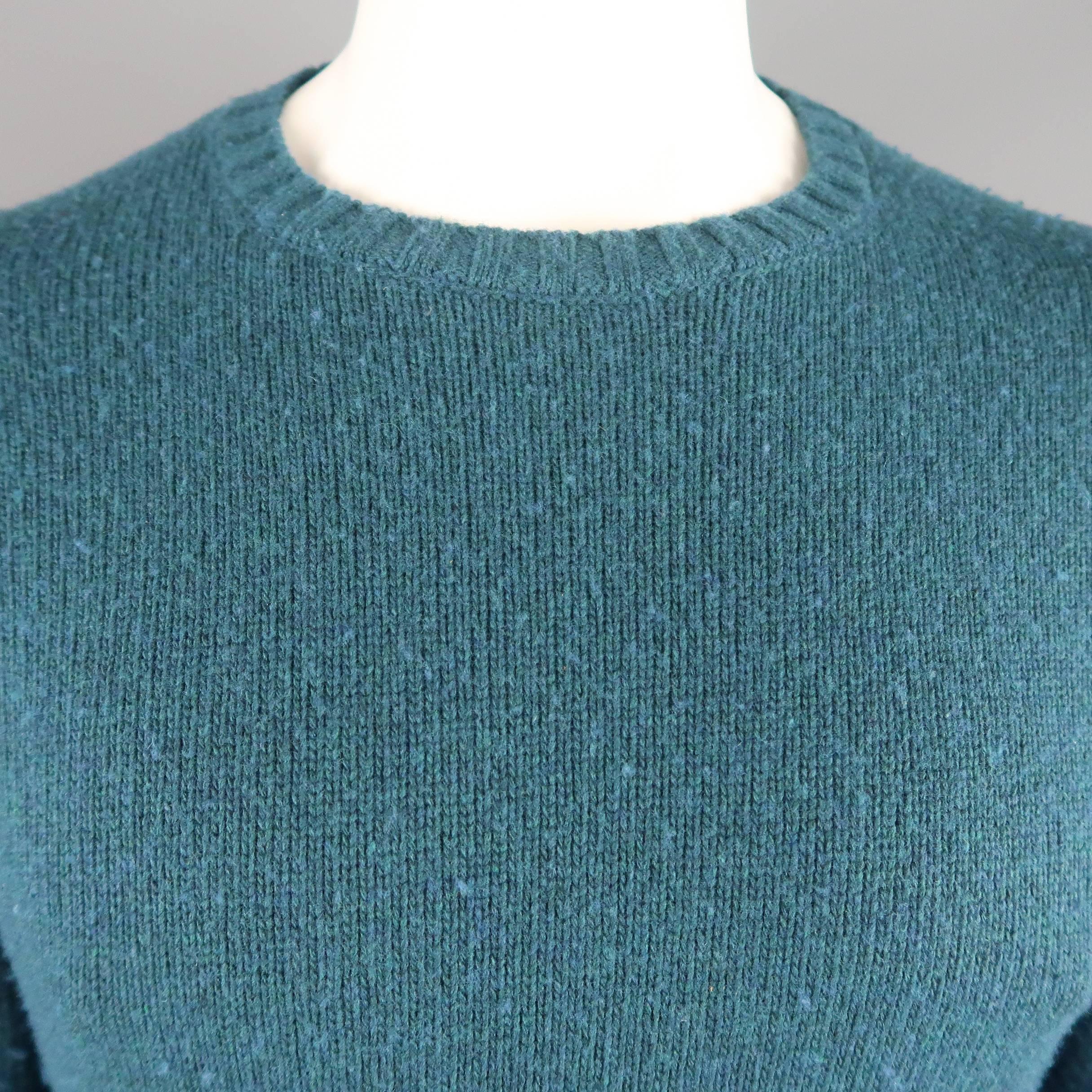 MAISON MARTIN MARGIELA pullover sweater comes in teal heather wool blend knit with a crewneck and back stitches. Wear throughout. As-is. Made in Italy.
 
Fair Pre-Owned Condition.
Marked: (no size)
 
Measurements:
 
Shoulder: 17 in.
Chest: 42