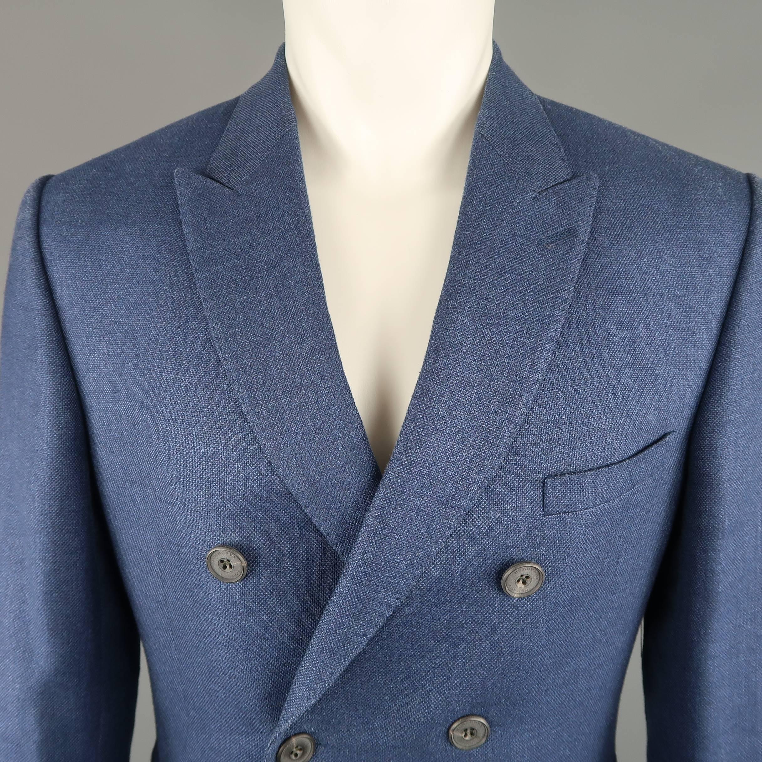 Double breasted BURBERRY LONDON sport coat comes in blue wool woven canvas with a peak lapel, and functional button cuffs. Wear on shoulders. As-is. Made in Portugal.
 
Good Pre-Owned Condition.
Marked: IT 52
 
Measurements:
 
Shoulder: 17