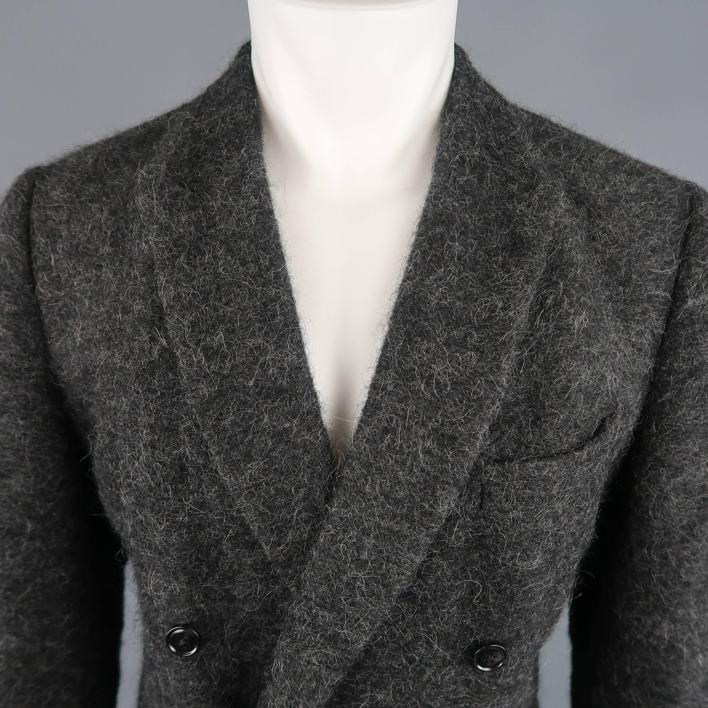 Double breasted DRIES VAN NOTEN sport coat comes in a fuzzy textured charcoal gray alpaca blend material with a peak lapel, flap pockets, and single vented back. Made in Morocco.
 
Excellent Pre-Owned Condition.
Marked: IT 52
 
Measurements:
