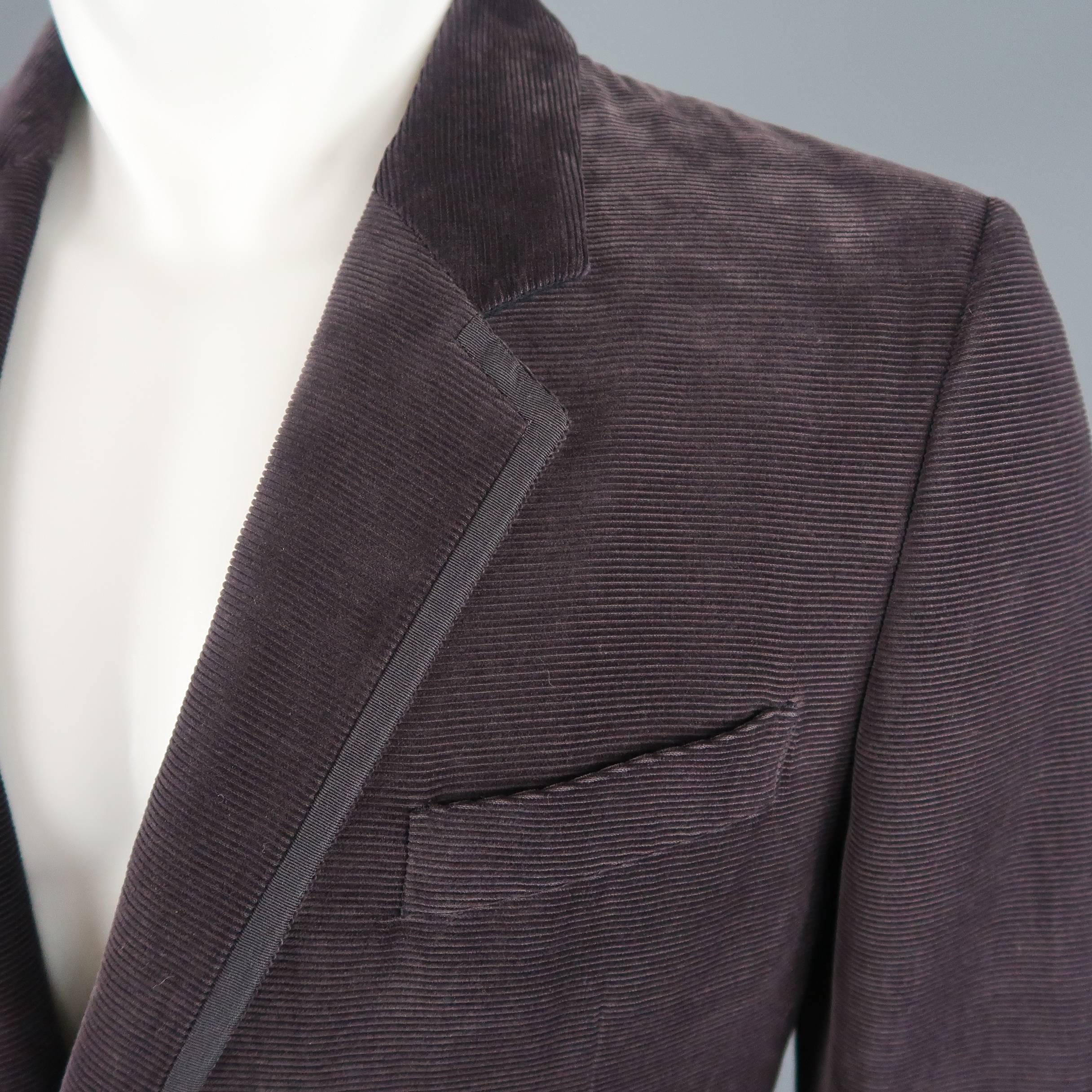 Single breasted SALVATORE FERRAGAMO sport coat comes in muted eggplant purple corduroy with a notch lapel, two button front, and grosgrain piping. Wear throughout. Made in Italy.
 
Fair Pre-Owned Condition.
Marked: IT 52
 
Measurements:
 
Shoulder: