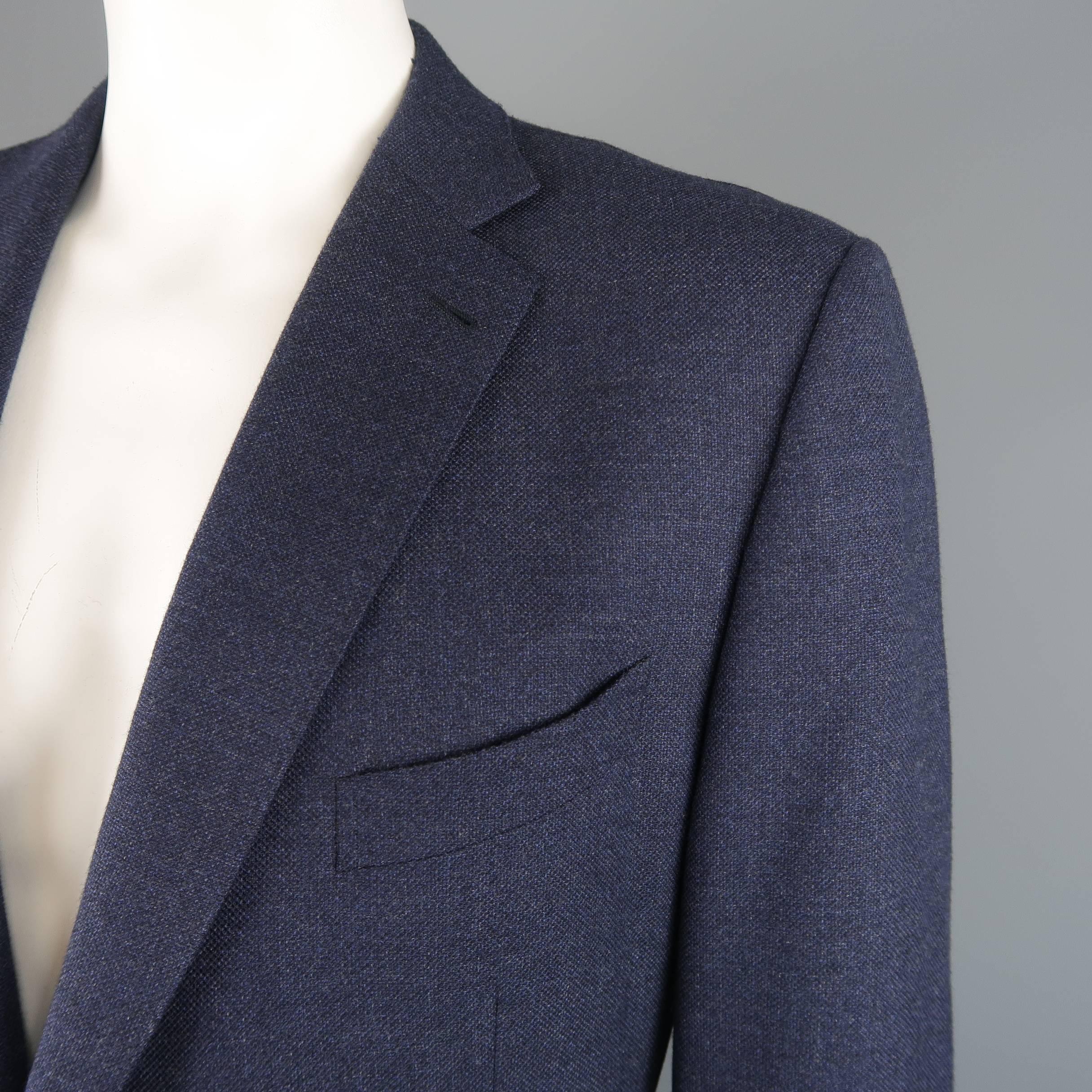 Single breasted EMERNEGILDO ZEGNA sport coat comes in navy woven textured wool with a notch lapel, two button front, and patch pockets. Imperfection on back. As-is. Made in Switzerland.
 
Good Pre-Owned Condition.
Marked: IT 60 R
 
Measurements:
 

