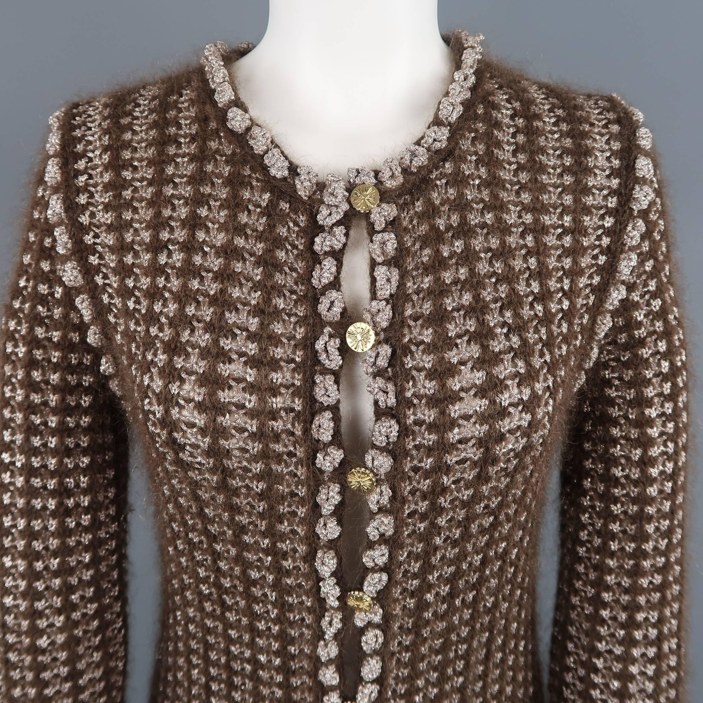 CHANEL Fall Winter 2004 Collection long cardigan comes in brown and silver mohair lurex textured knit with a round collar, patch pockets, lace trim, and gold tone rhinestone buttons. Label removed. As-is.
 
Good Pre-Owned Condition.
Marked: (no