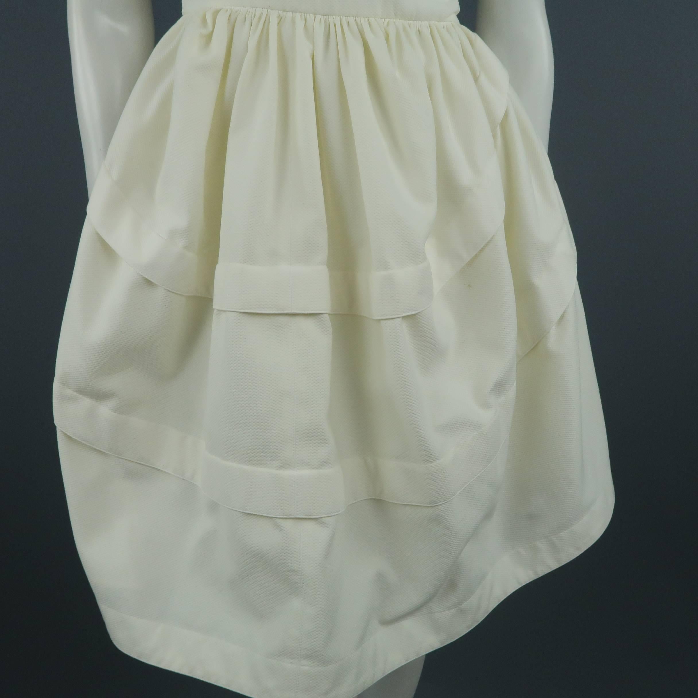 Vintage ALAIA cocktail dress comes in cream cotton textured canvas with an asymmetrical one shoulder sleeveless bodice and gathered puff skirt with draped back. Wear throughput.
 
Fair Pre-Owned Condition.
Marked: (no size)
 
Measurements:
    Bust: