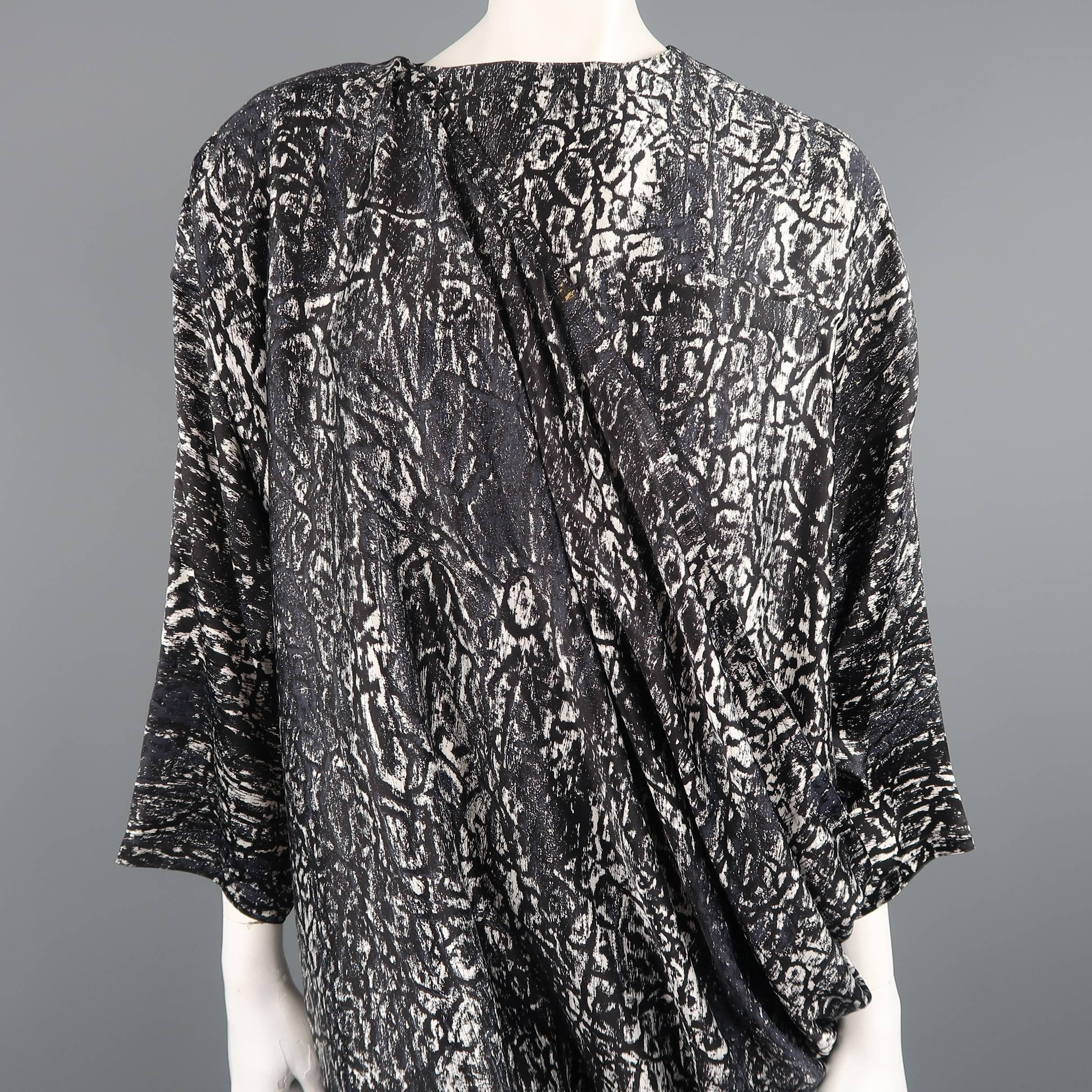 Vintage Early 1980's GIANNI VERSACE shift dress comes in charcoal gray and cream marbled cheetah print sateen and features a crewneck boxy three quarter top with padded shoulder, three quarter sleeves, and an asymmetrical draped skirt from the