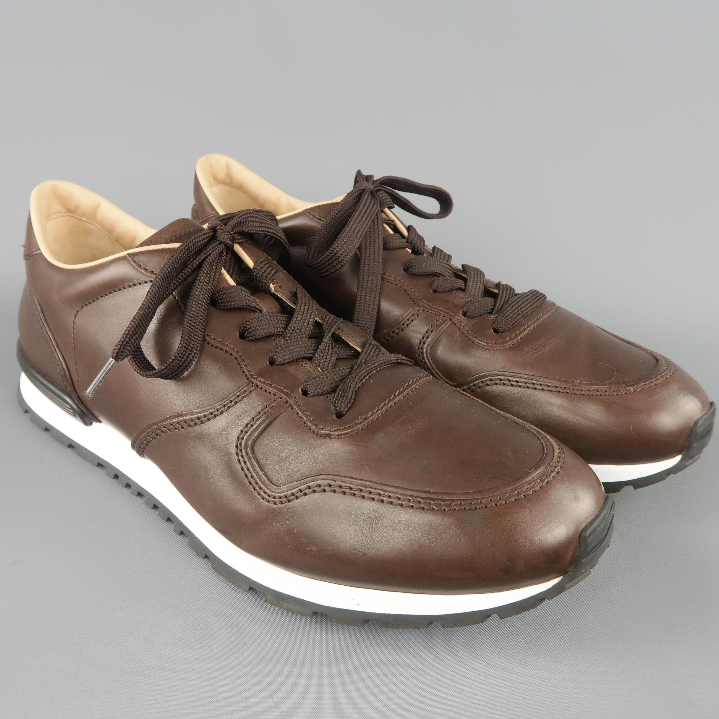 TOD'S trainers come in chocolate brown leather with a lace up front, and white midsole. Made in Italy.
 
Excellent Pre-Owned Condition.
Marked: UK 11
 
Outsole: 13 x 4.5 in.