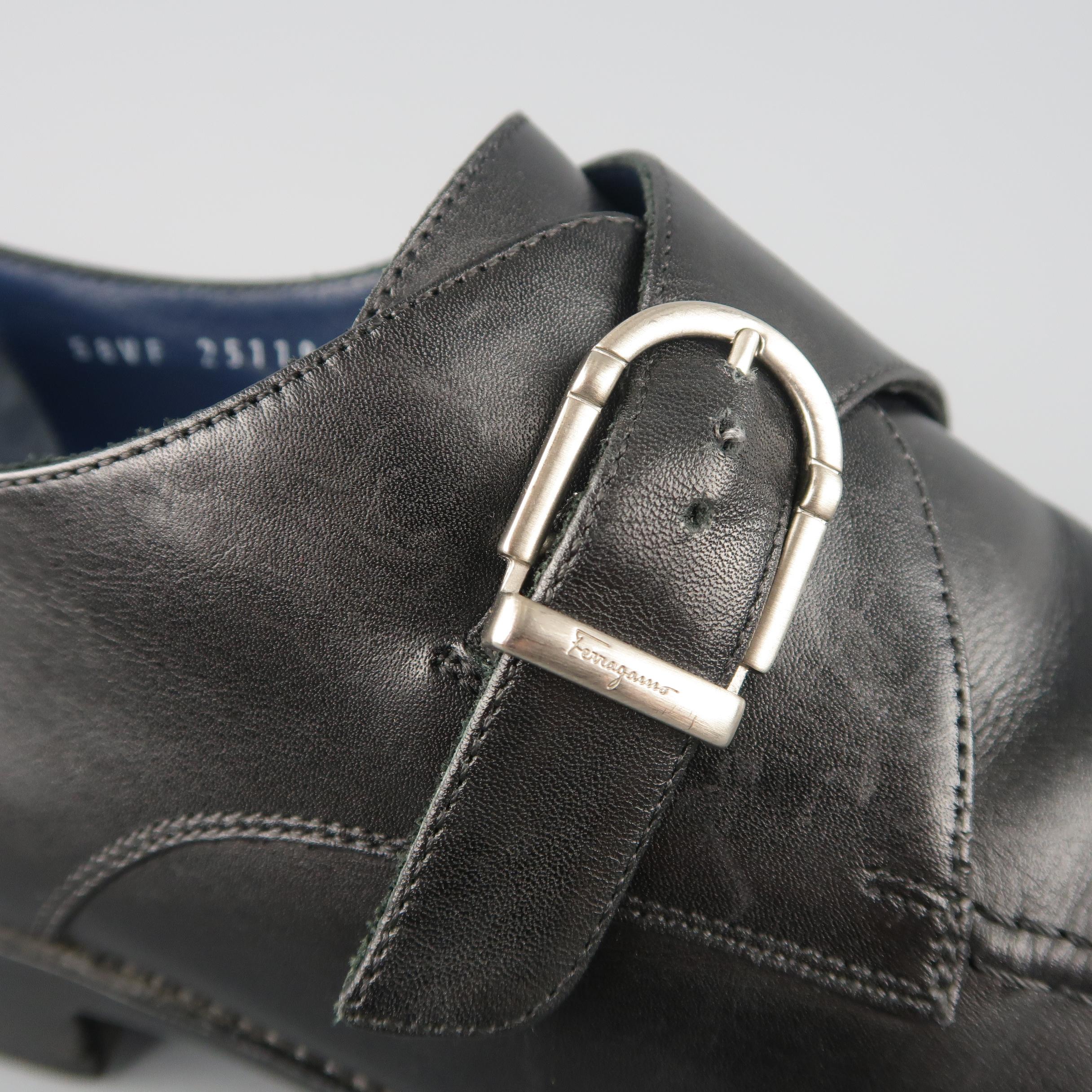 SALVATORE FERRAGAMO dress shoes come in smooth black leather with a pointed apron toe and monk strap with matte silver tone engraved buckle.  Made in Italy.
 
Good Pre-Owned Condition.
Marked: UK 10.5
 
Outsole: 12.5 x 4 in.