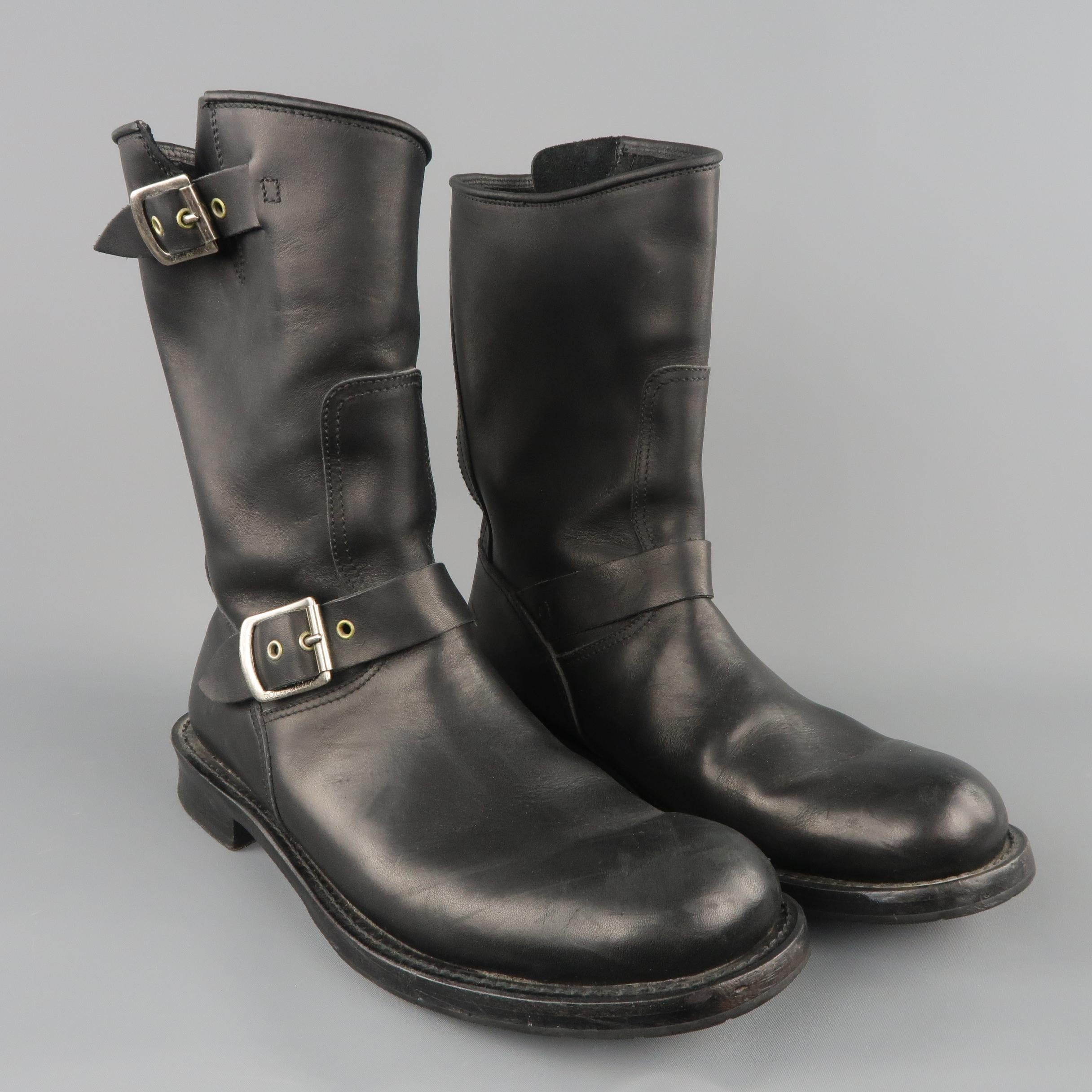 DOLCE & GABBANA biker boots come in smooth black leather with a round toe and double buckled straps. Made in Italy.
 
Good Pre-Owned Condition.
Marked: UK 7.5
 
Outsole: 12 x 4.5 in.
Length: 9.5 in.