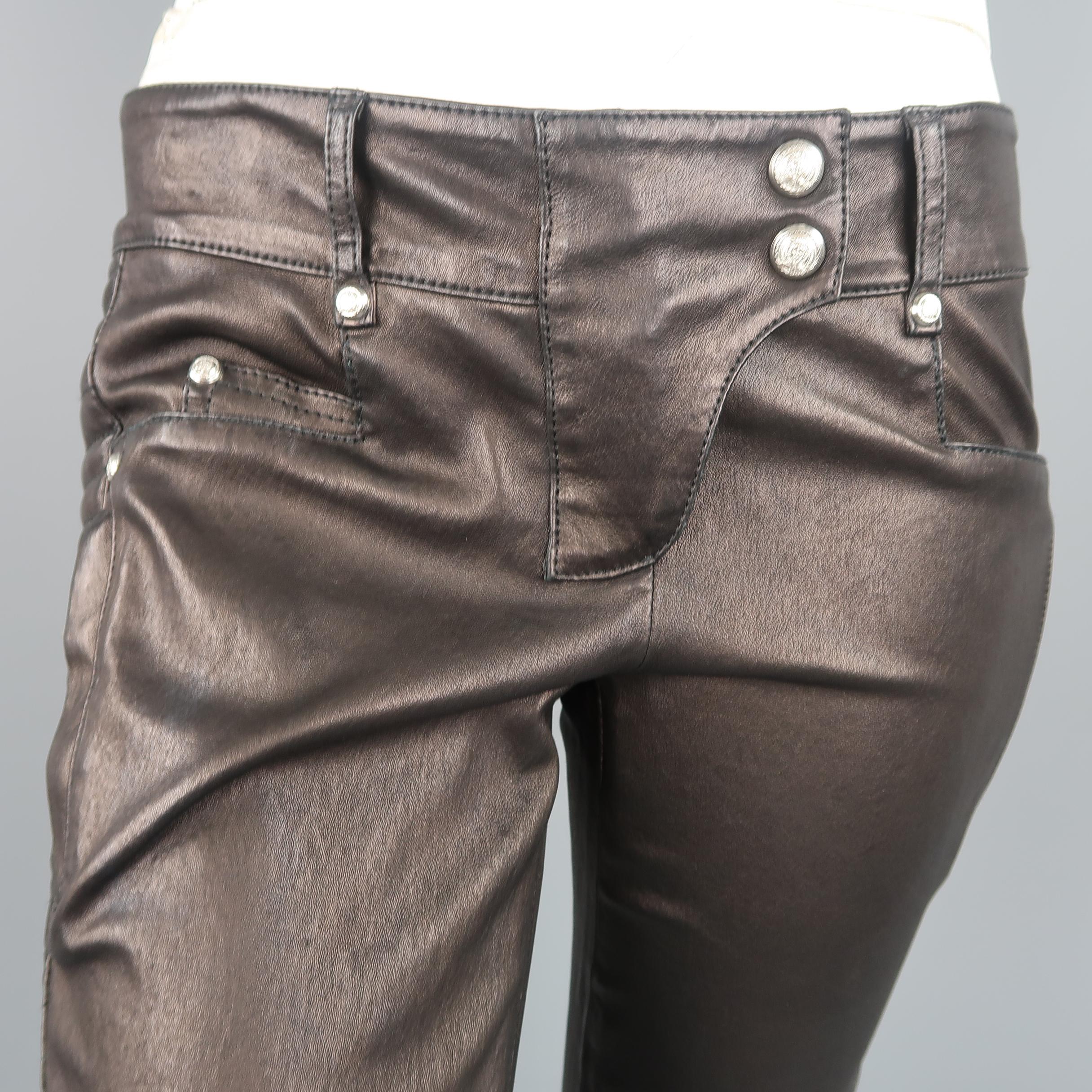 Balmain low rise motorcycle biker pants come in supple black smooth stretch leather with silver tone engraved studs, zip legs, knee pad seams, back belt, and quilted panels. No signs of wear.  Retailed at $3995.00

Excellent Pre-Owned