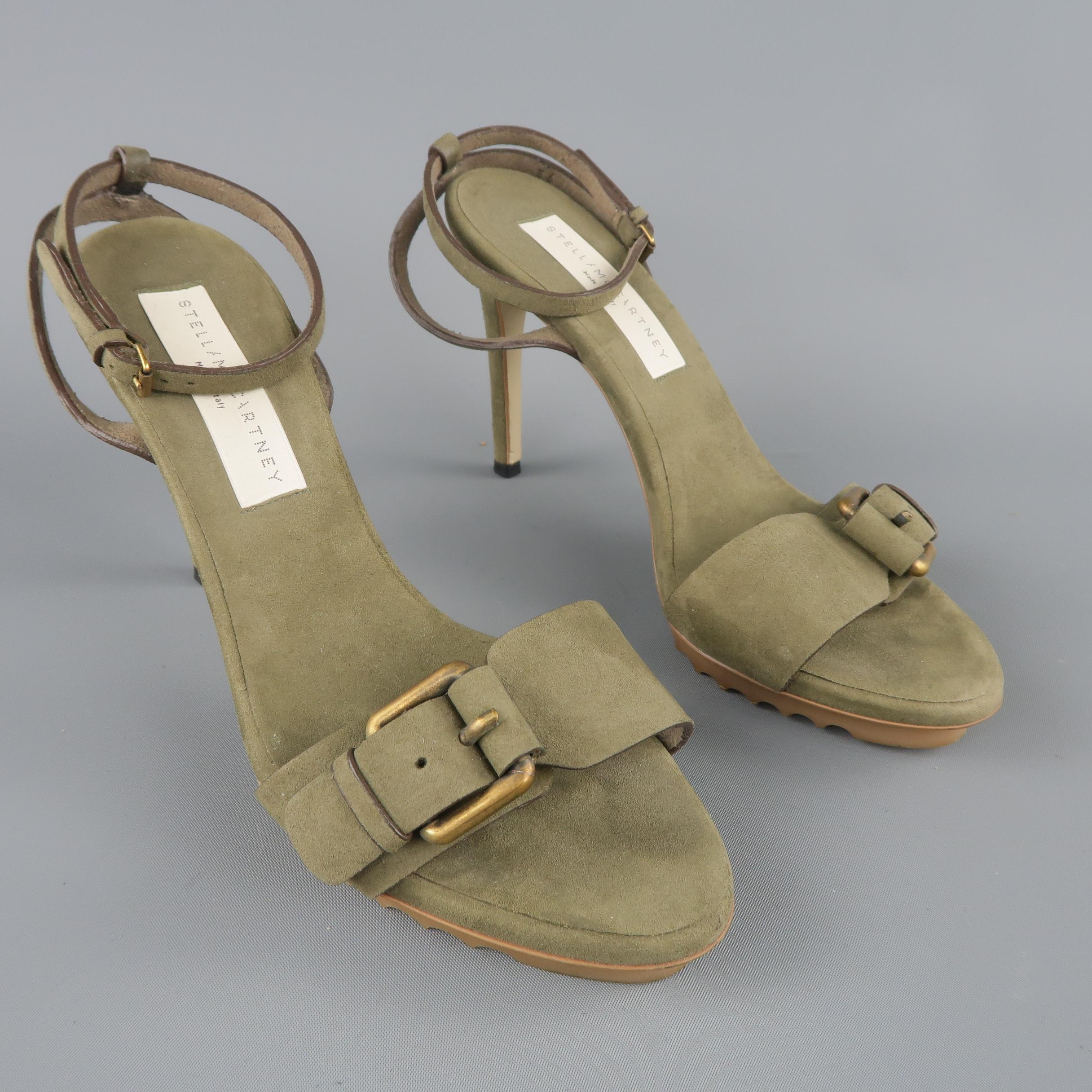 STELLA MCCARTNEY sandals come in olive green vegan suede with a thick gold tone buckle toe strap, rubber commando platform, covered heel, and wrapped ankle strap. Wear throughout. As-is. Made in Italy.
 
Fair Pre-Owned Condition.
Marked: IT 36
