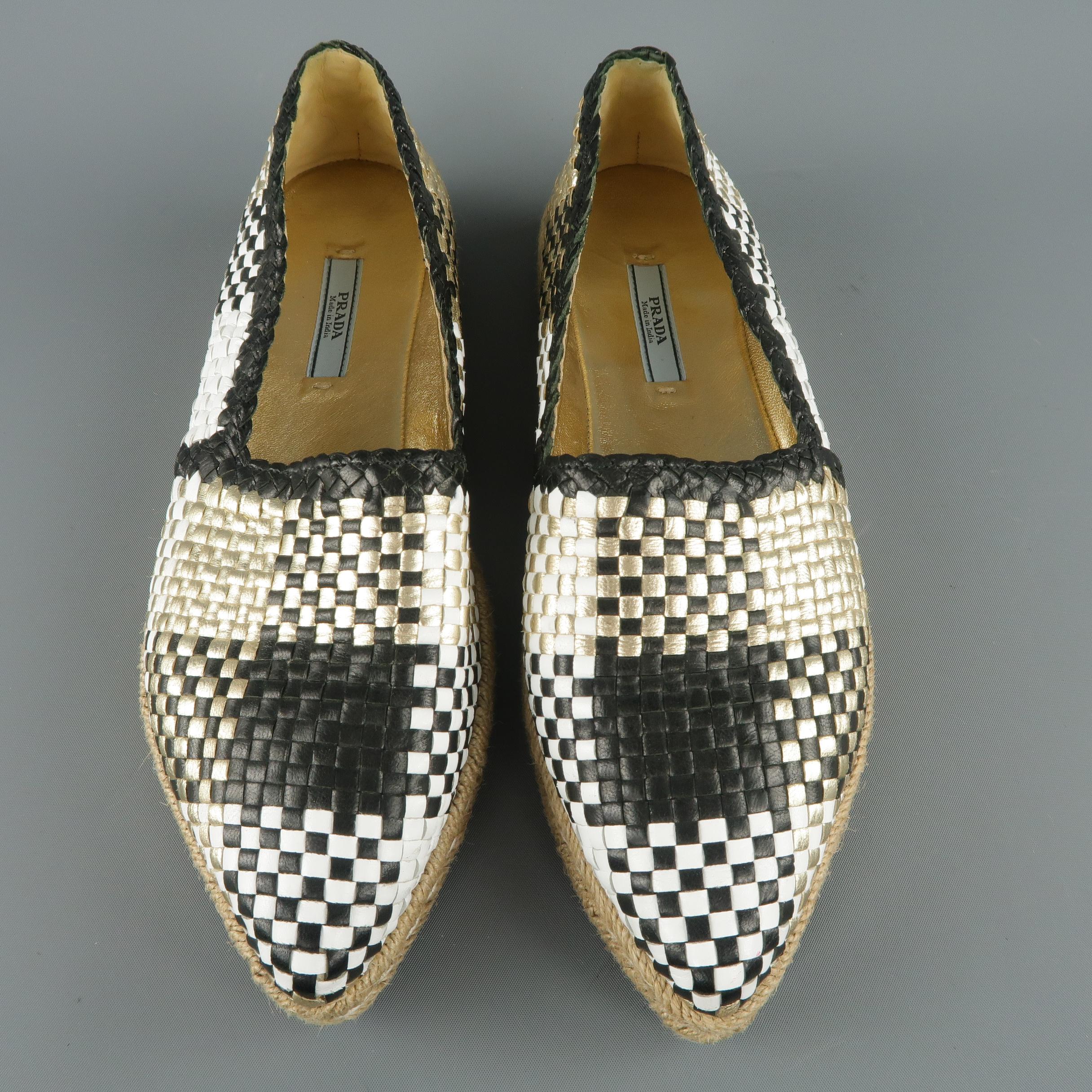 PRADA espadrilles come in black, white, and metallic gold woven leather in a Madras plaid print with a pointed toe and braided rope trim sole.
 
Excellent Pre-Owned Condition.
Marked: IT 37.5
 
Outsole: 10.5 x 3.25 in.