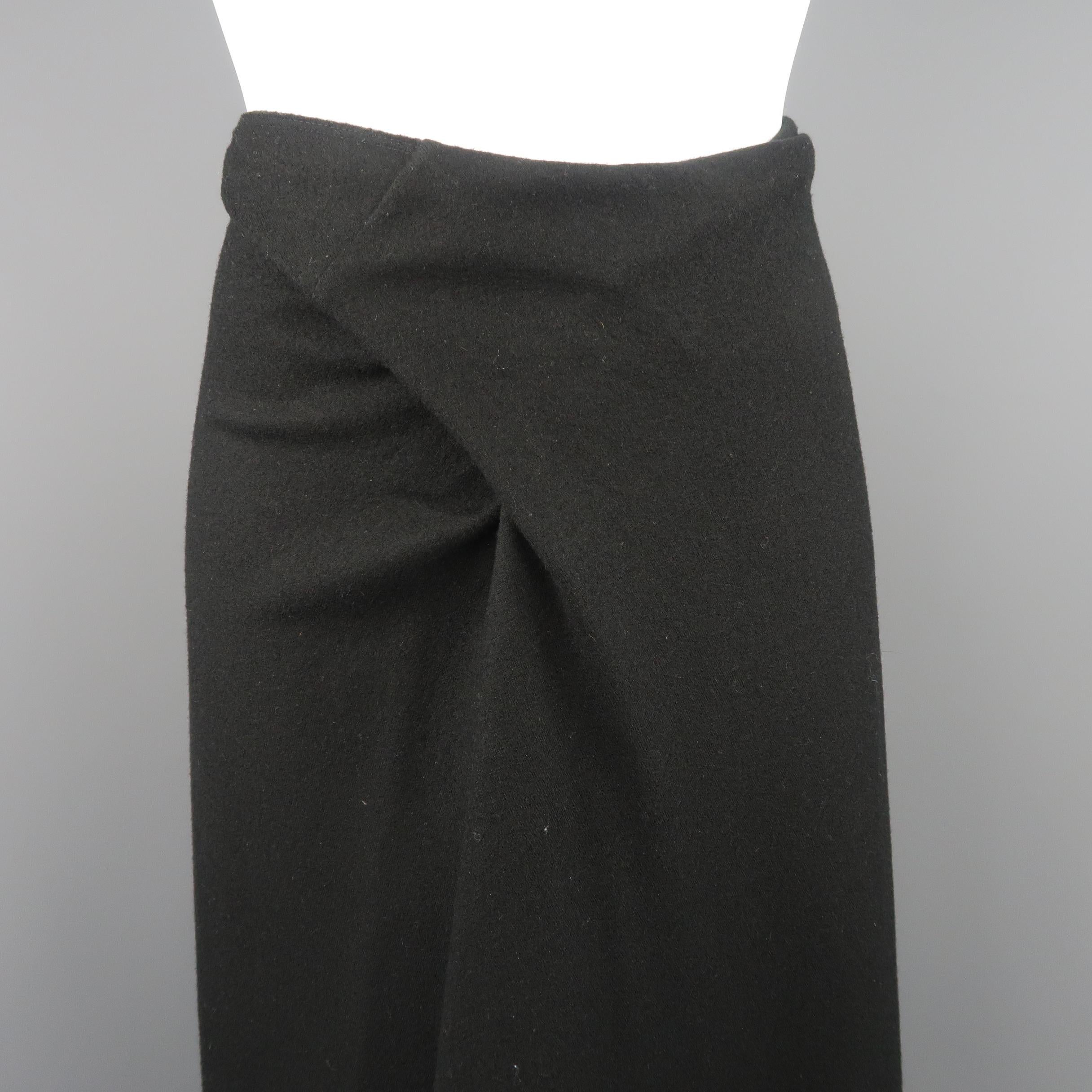 Vintage ISSEY MIYAKE skirt comes in black wool flannel with a twisted waistband and wrap pleated front. Made in Japan.
 
Good Pre-Owned Condition.
Marked: JP 4
 
Measurements:
 
Waist: 33 in.
Hip: 40 in.
Length: 33 in.