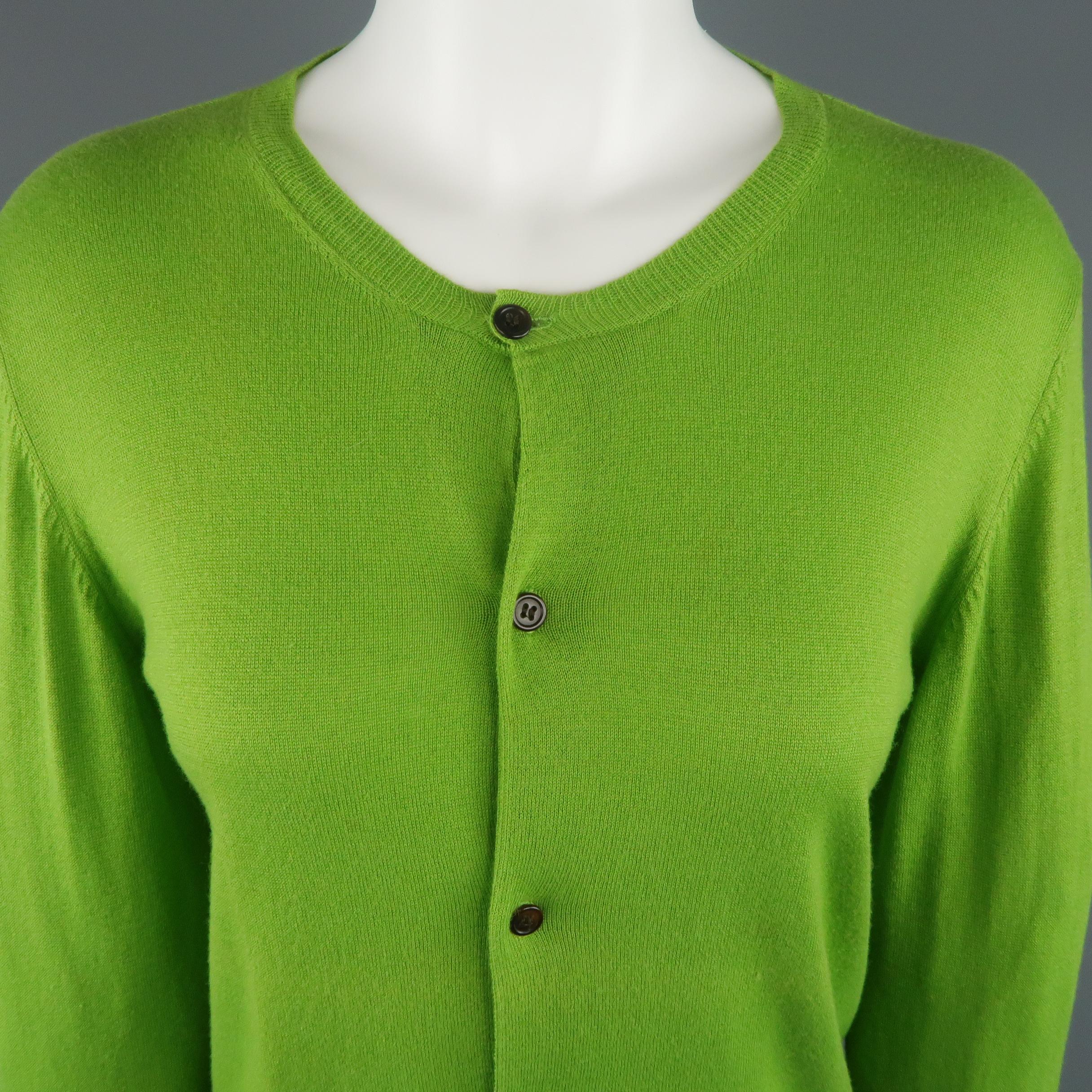 Y'S by YOHJI YAMAMOTO cardigan comes in green cotton blend knit light weight knit with a round neck and olive green ribbed back panel.
 
Excellent Pre-Owned Condition.
Marked: JP 2
 
Measurements:
 
Shoulder: 17 in.
Bust: 36 in.
Sleeve: 28