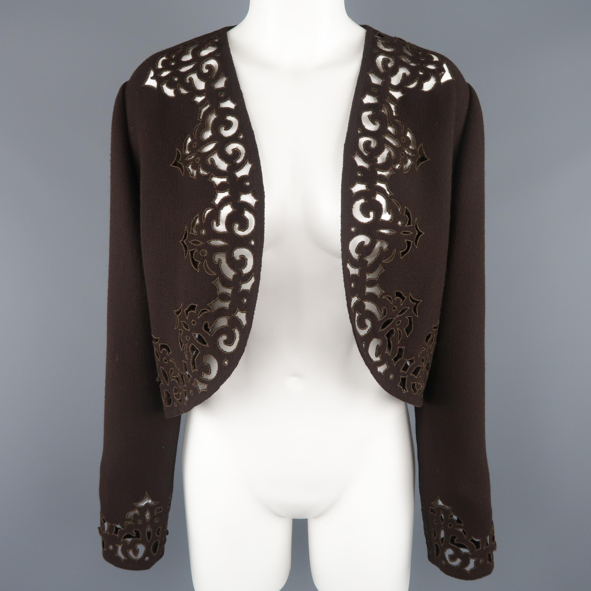 Vintage BILL BLASS bolero jacket comes in rich brown wool blend crepe with an open front, cropped hem, and cutout floral trim. Made in USA.
 
Excellent Pre-Owned Condition.
Marked: 12
 
Measurements:
 
Shoulder: 18 in.
Bust: 42 in.
Sleeve: 20