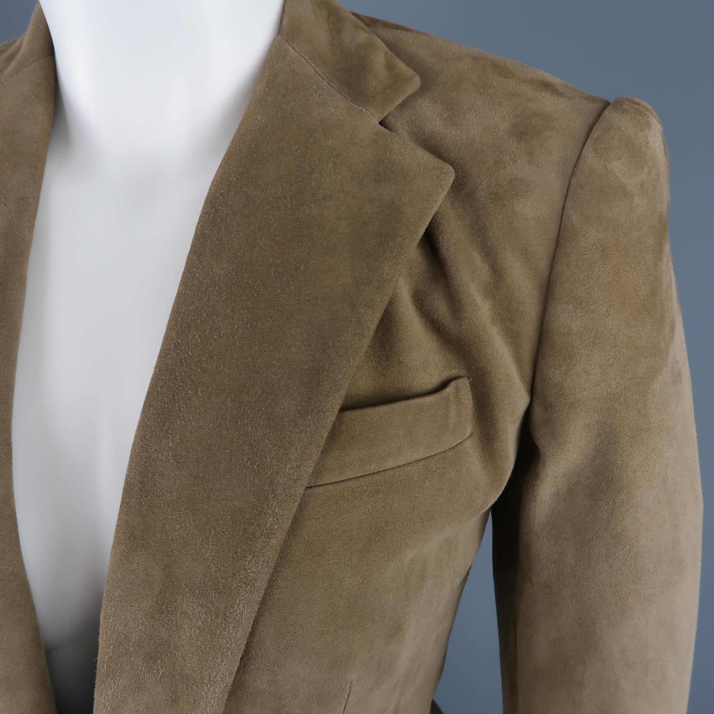 RALPH LAUREN BLACK LABEL sport coat comes in taupe suede with a notch lapel, single button front, and flap pockets. Spot on back. Made in USA.
 
Fair Pre-Owned Condition.
Marked: 4
 
Measurements:
 
Shoulder: 15 in.
Bust: 33 in.
Sleeve: 25